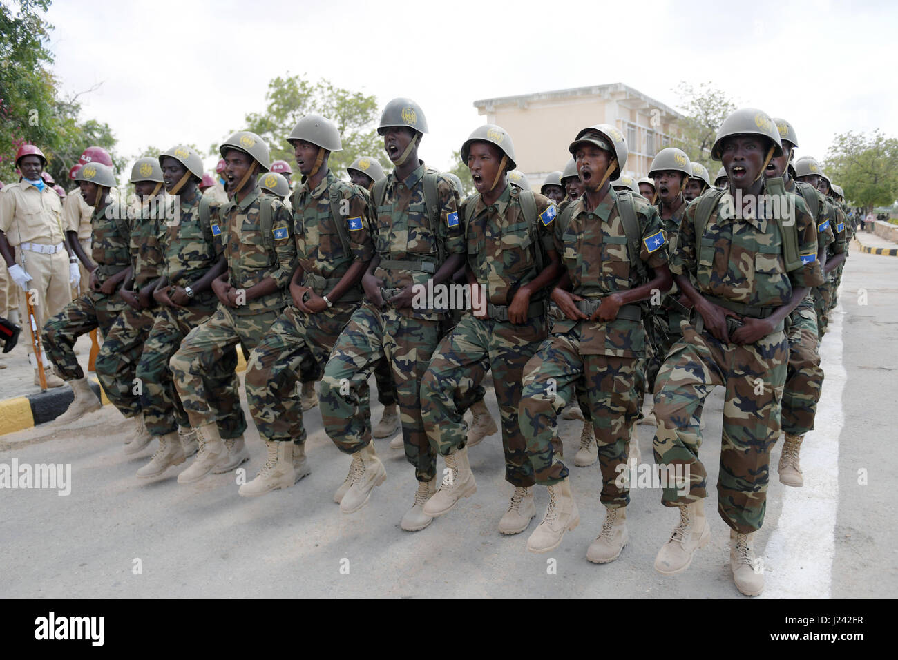 Soldiers in the Somali Defence forces parade during  a ceremony to mark the 57th Anniversary of the Somali National Army held April 12, 2017 in Mogadishu, Somalia. Stock Photo