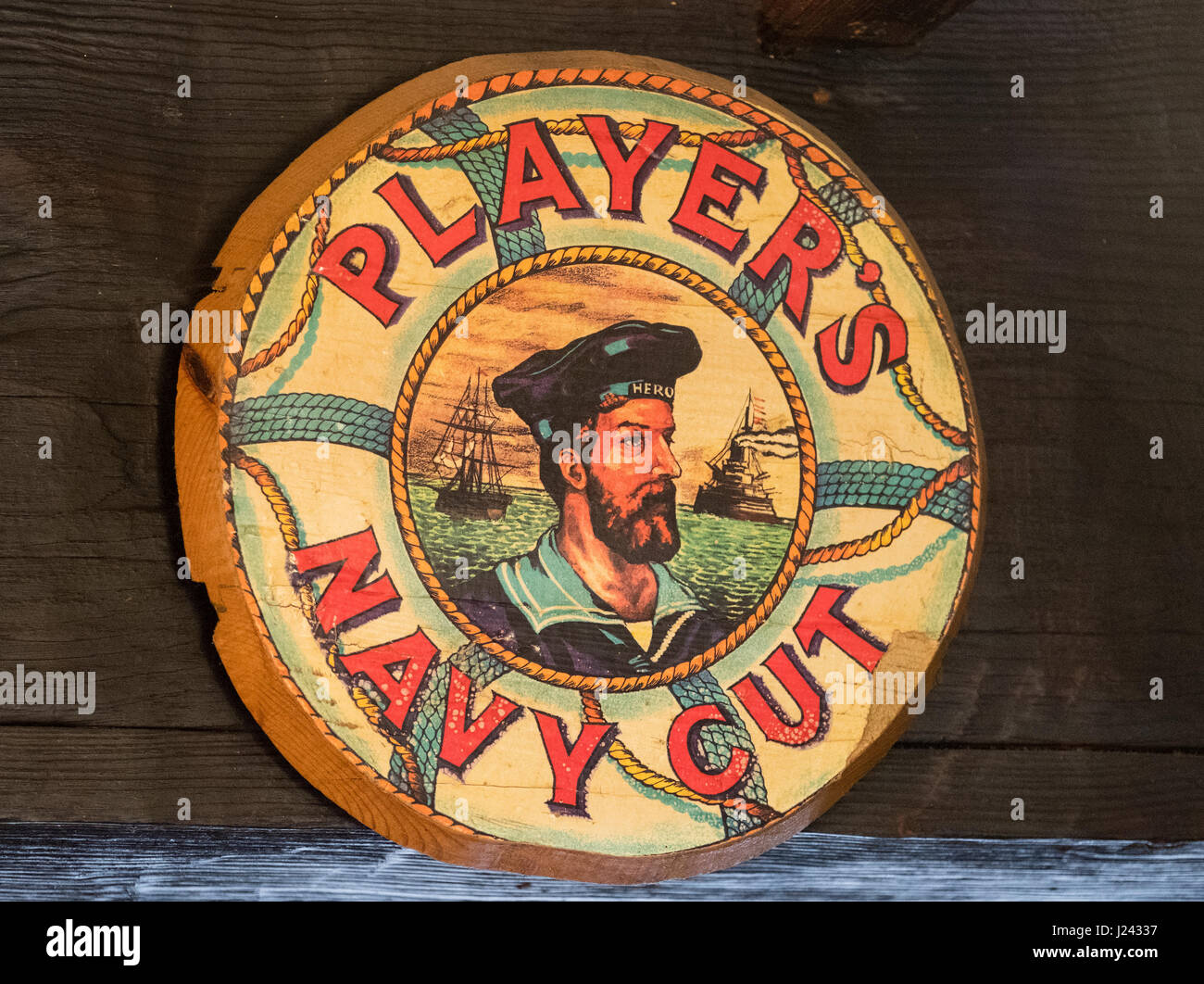 Players Navy Cut advertisement on a wooden beam. Stock Photo