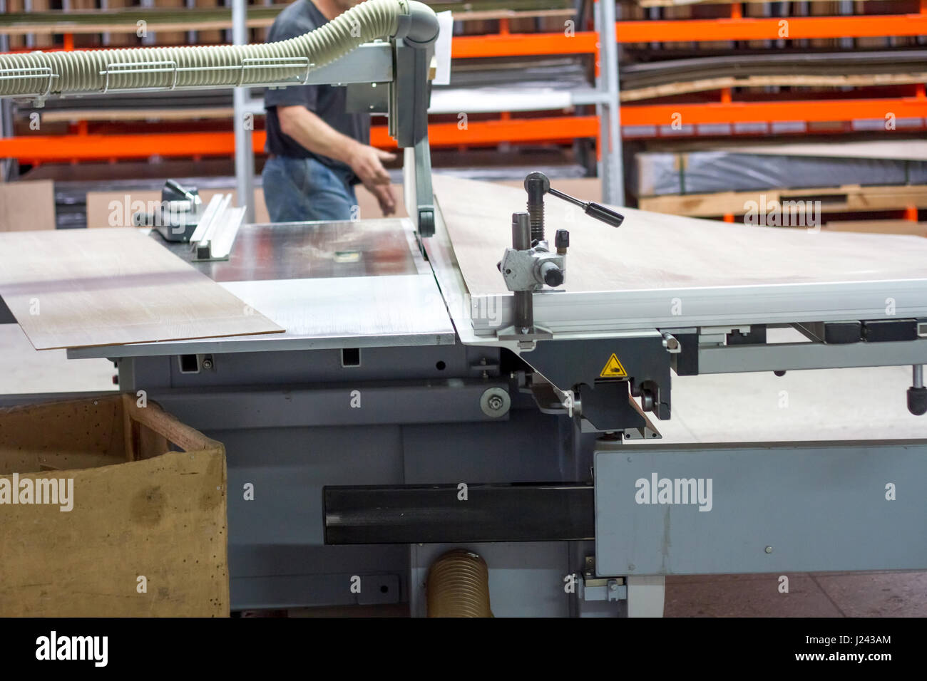 Men at work sawing wood. Circular saw. A machine which saws wood