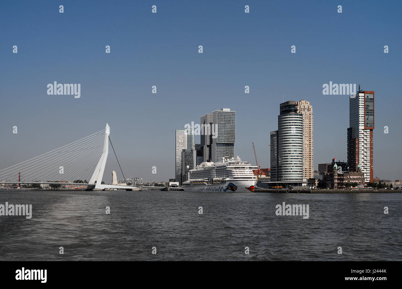 Rotterdam harbor skyline erasmus bridge over nieuwe maas, aida liner at cruise terminal  and towers wilhelminapier  netherlands Stock Photo