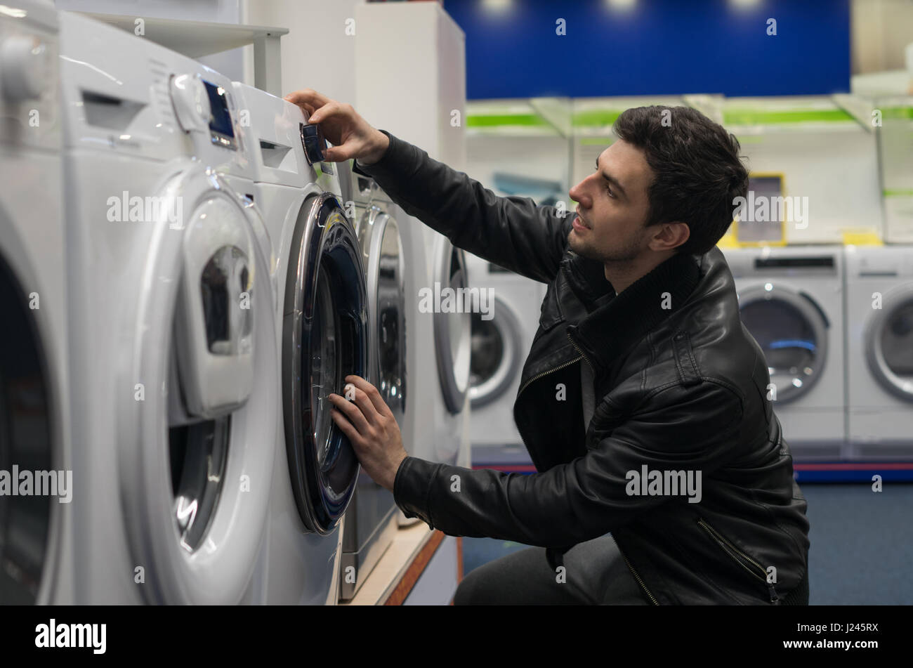 male customer choosing washing machine Stock Photo