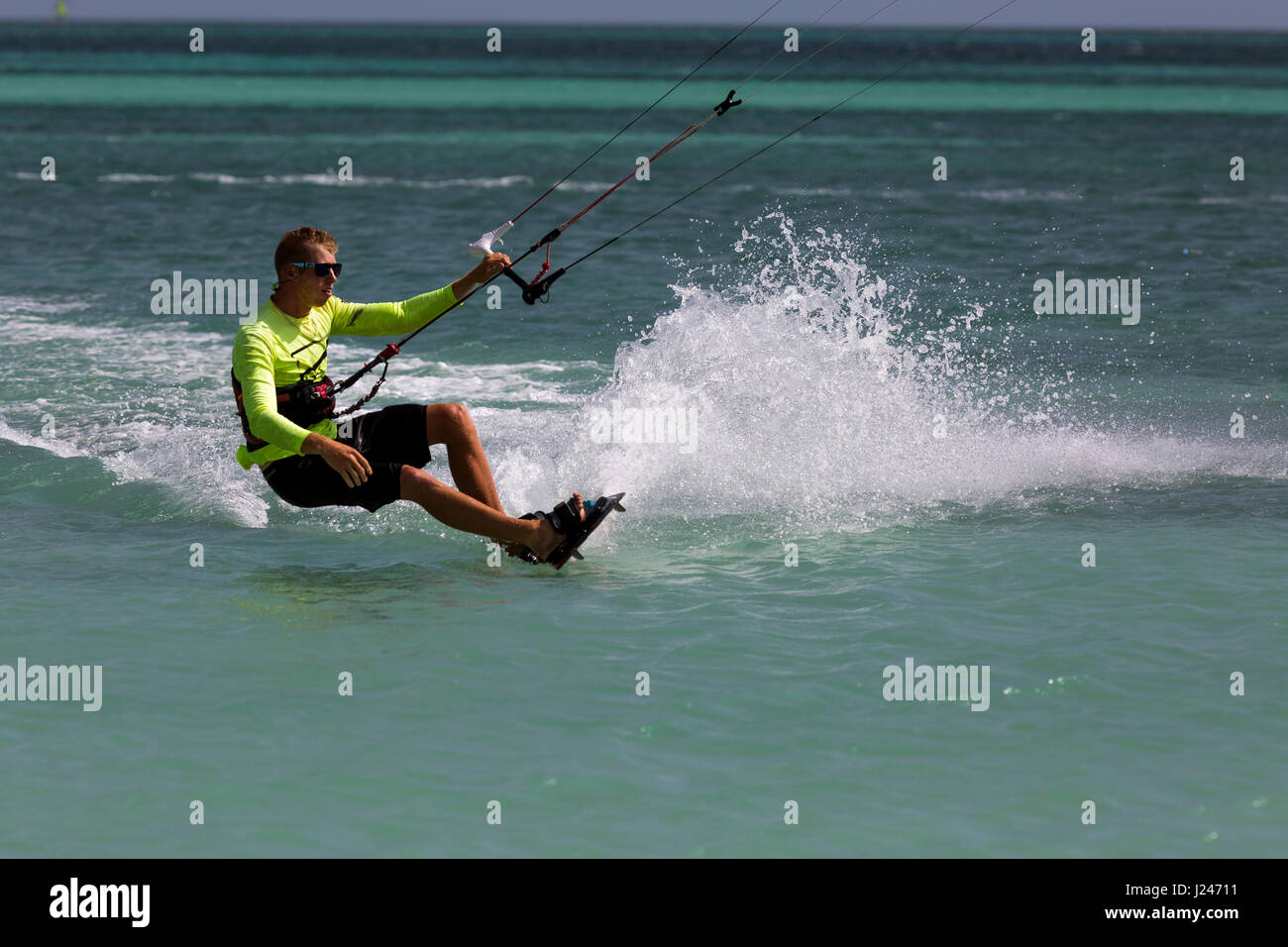 A young man parasailing at Hadicurari Beach, Aruba Stock Photo