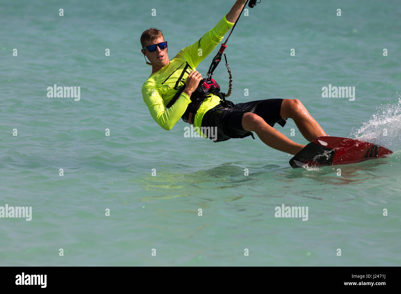 A young man parasailing at Hadicurari Beach, Aruba Stock Photo