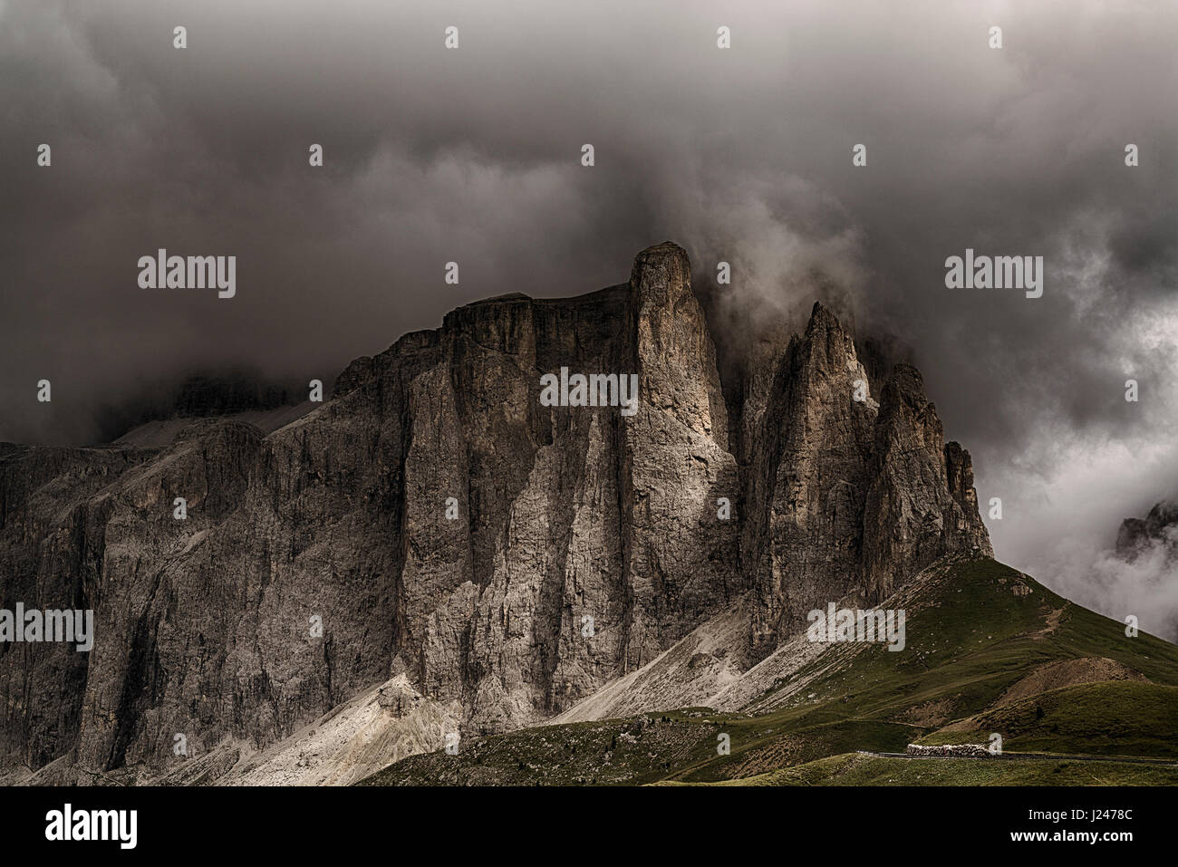 Storm formation over the top of Sella Towers in summer season, danger for mountain climbing - Trentino-Alto Adige, Italy Stock Photo