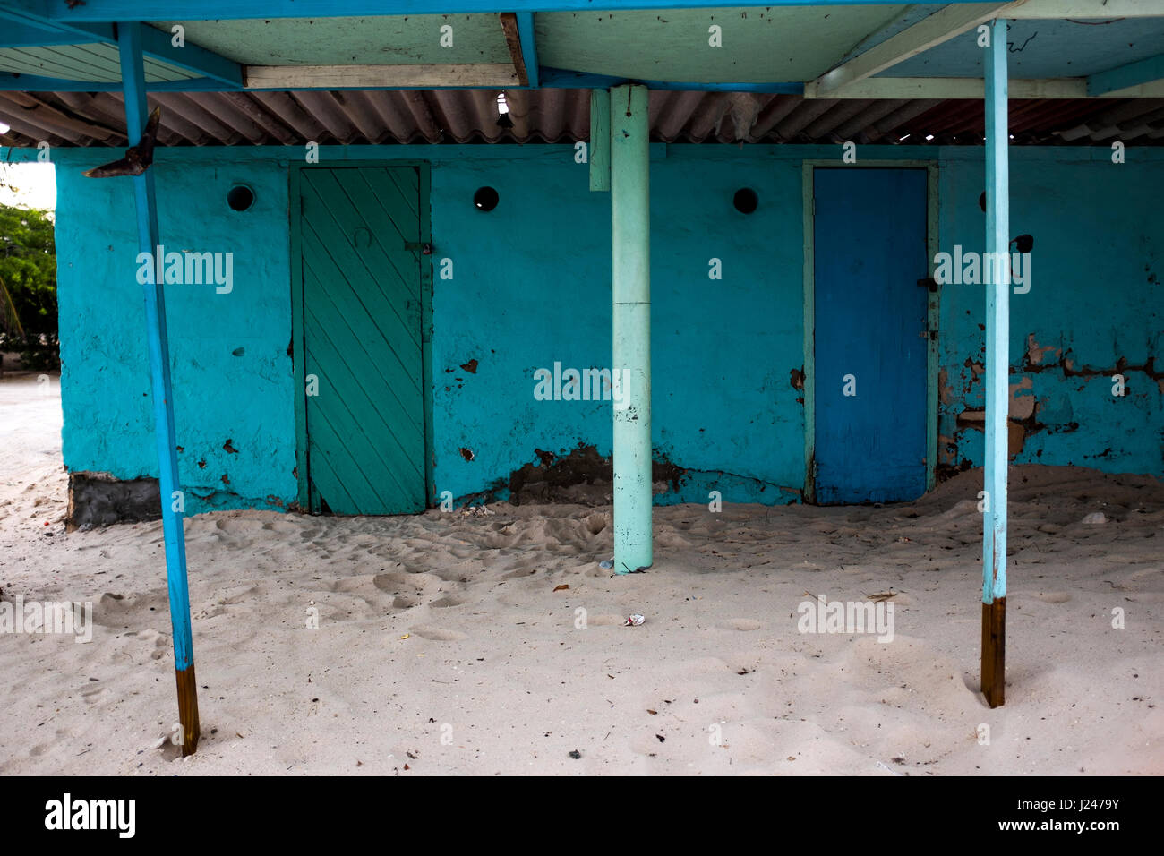 Colourful fishermans' huts, now used as beach cabanas, on Hadicurari Beach, Aruba. Stock Photo