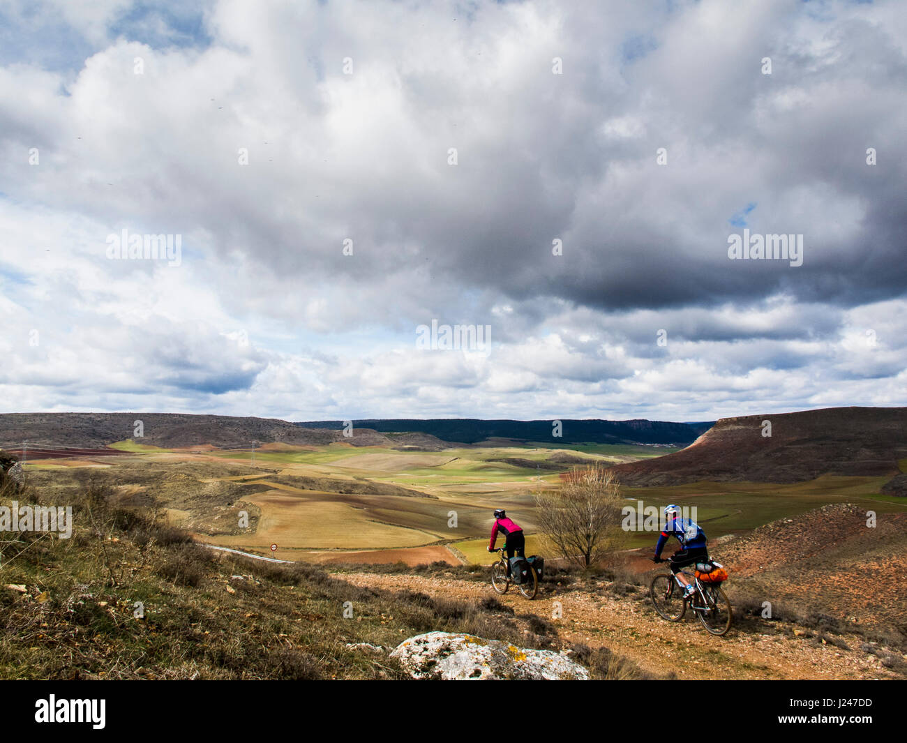 Mountain bikers in a spanish landscape in Ruta del Cid path Stock Photo