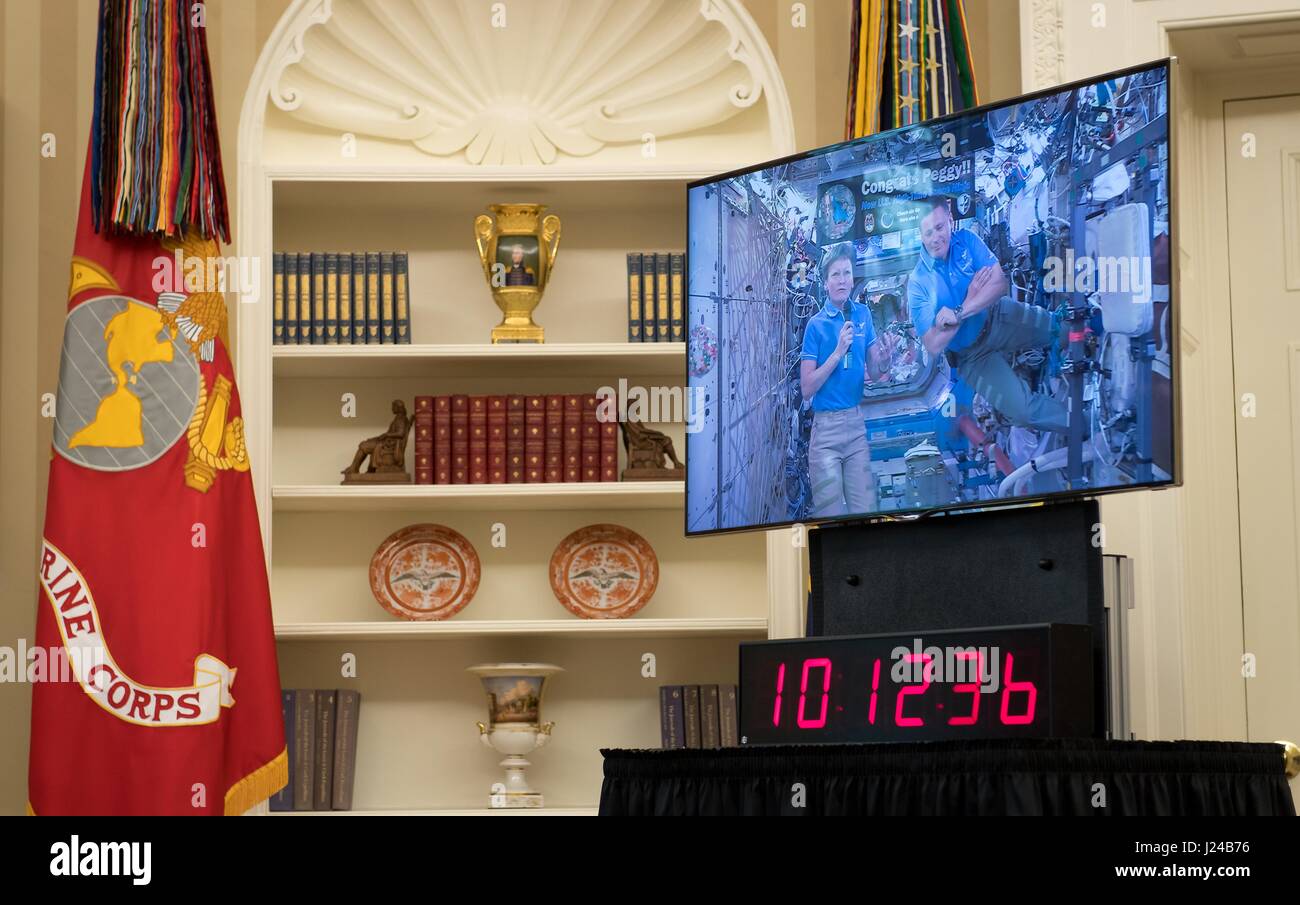 Houston, USA. 24th Apr, 2017. NASA astronauts Peggy Whitson and Jack Fischer are seen onboard the International Space Station in a live video conference between with President Donald Trump in the Oval Office of the White House April 24, 2017 in Washington, DC. Trump congratulated Whitson for breaking the record for cumulative time spent in space by a U.S. astronaut. Credit: Planetpix/Alamy Live News Stock Photo