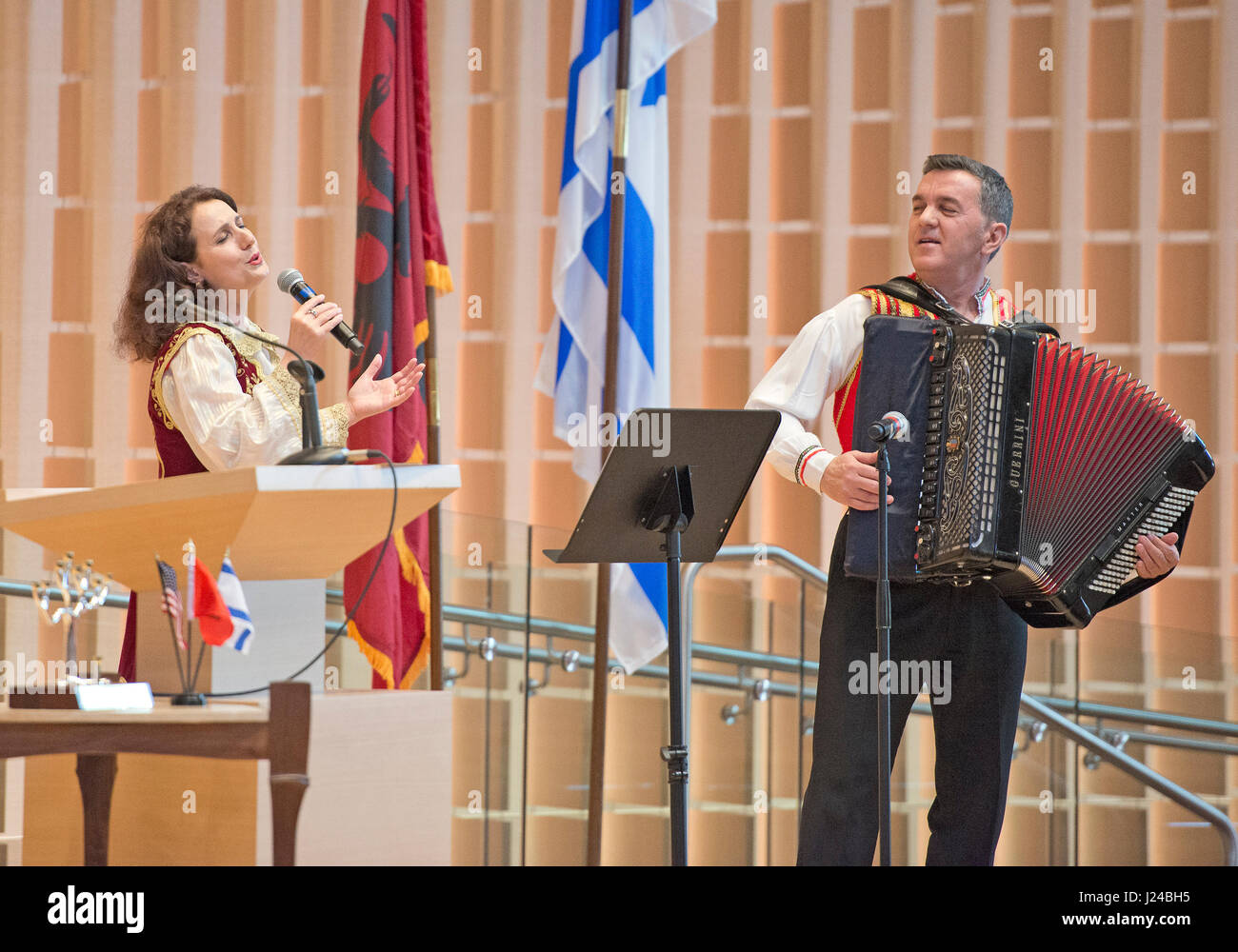 Several hundred people gather Sunday, April 23, 2017 at Washington, DC·s Adas Israel Congregation to commemorate Yom Hashoah, Holocaust Remembrance Day, with the synagogue·s annual Garden of the Righteous ceremony, honoring non-Jews who risked their lives to save Jews during the Holocaust. This year·s honoree was the Veseli family from Albania, who sheltered two Jewish families in Kruja, Albania during World War II. At the ceremony, Albanian folk musicians Raif Hyseni (R) and Merita Halili perform in honor of the Veseli family. Credit: Ron Sachs/CNP - NO WIRE SERVICE - Photo: Ron Sachs Stock Photo