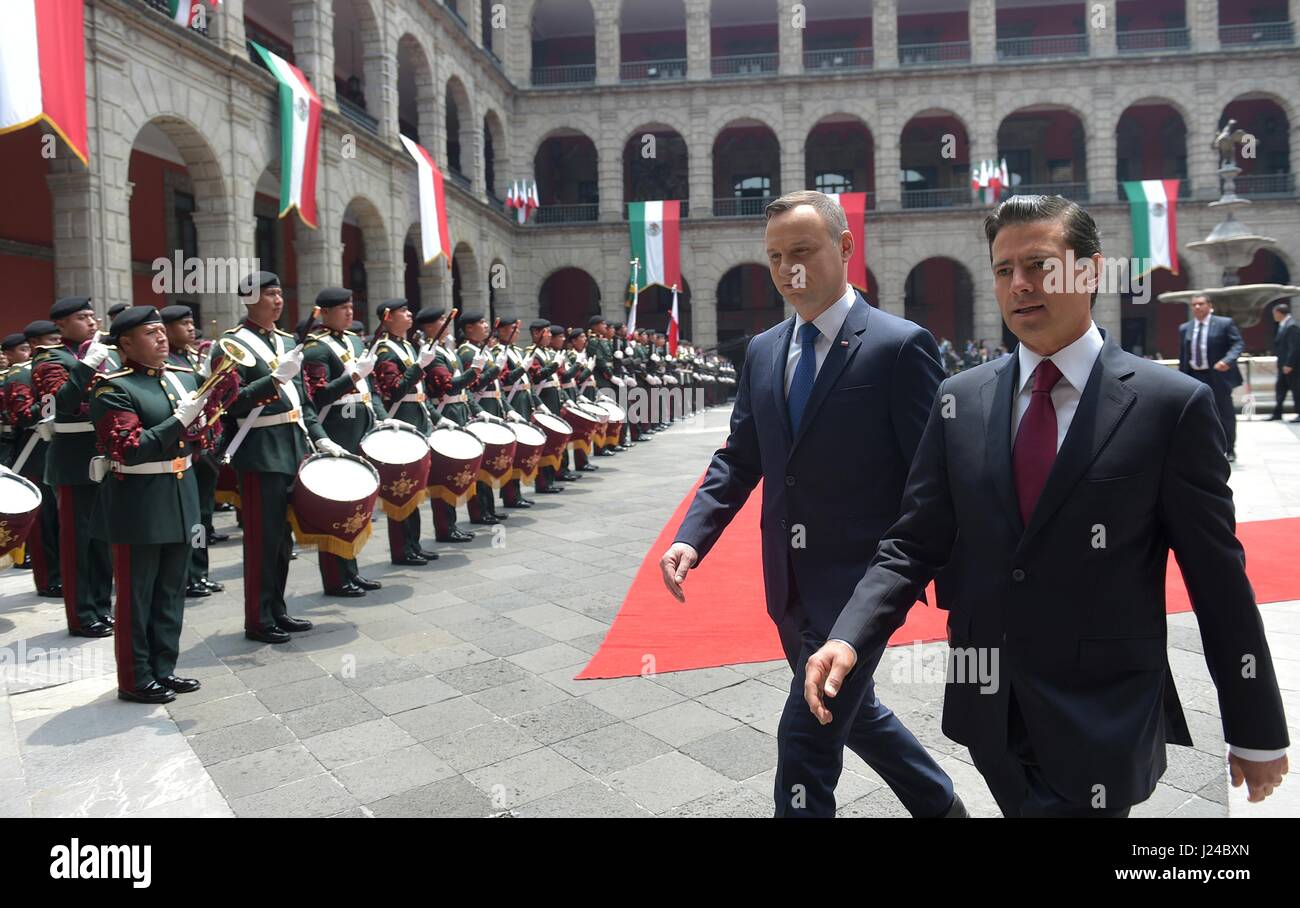 Mexico City, Mexico. 24th April, 2017. Mexican President Enrique Pena Nieto, right, escorts Polish President Andrzej Duda into the national palace following the formal arrival ceremony April 24, 2017 in Mexico City, Mexico. Credit: Planetpix/Alamy Live News Stock Photo