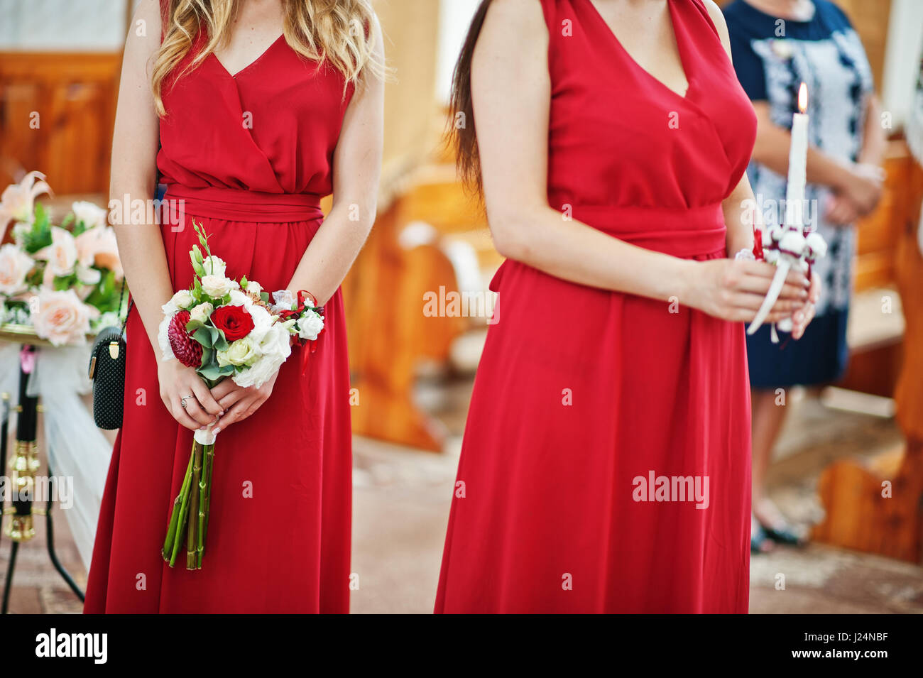 Two bridesmaids holding bouquet hi-res stock photography and images - Alamy