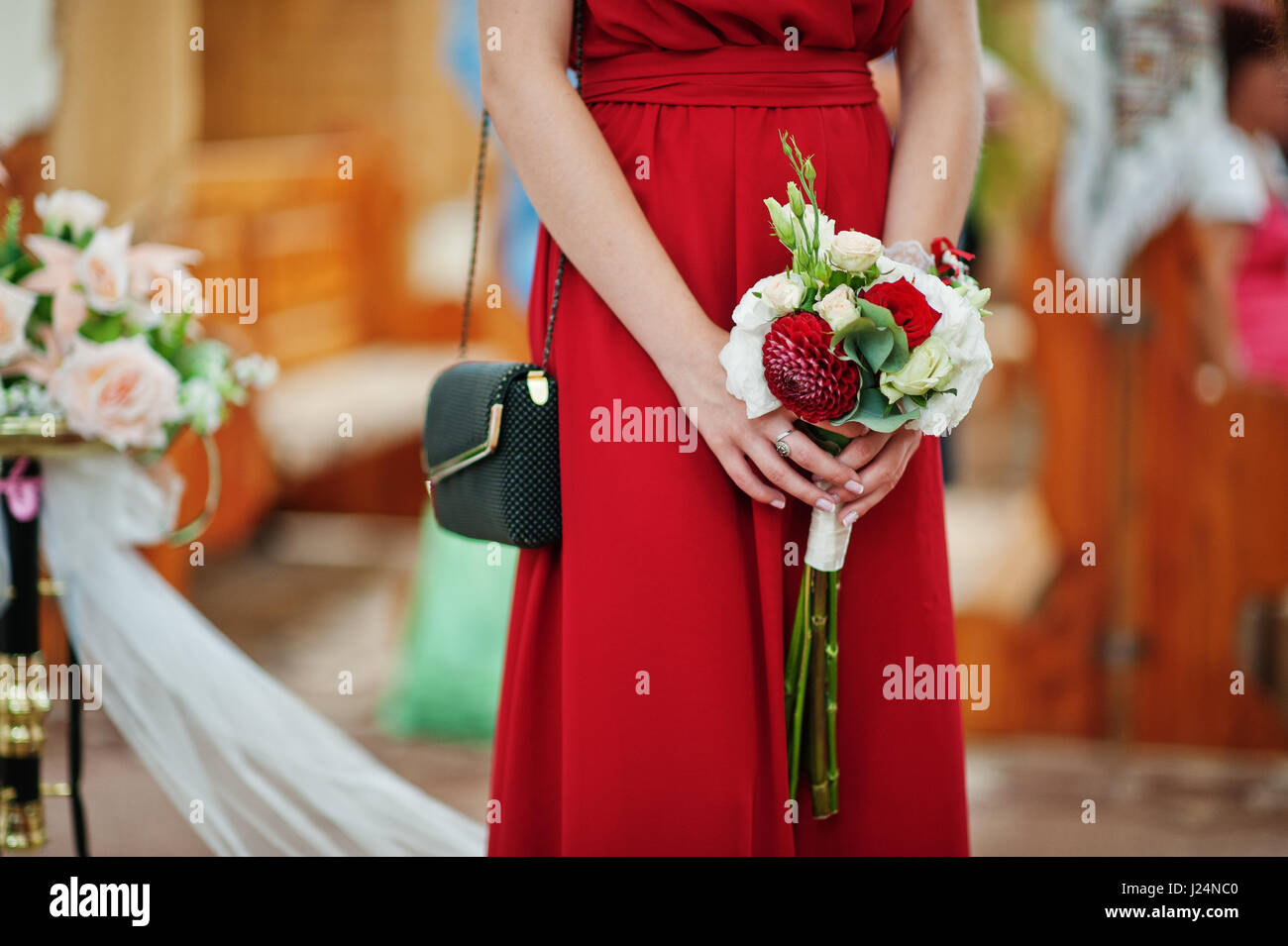 Two bridesmaids holding bouquet hi-res stock photography and images - Alamy