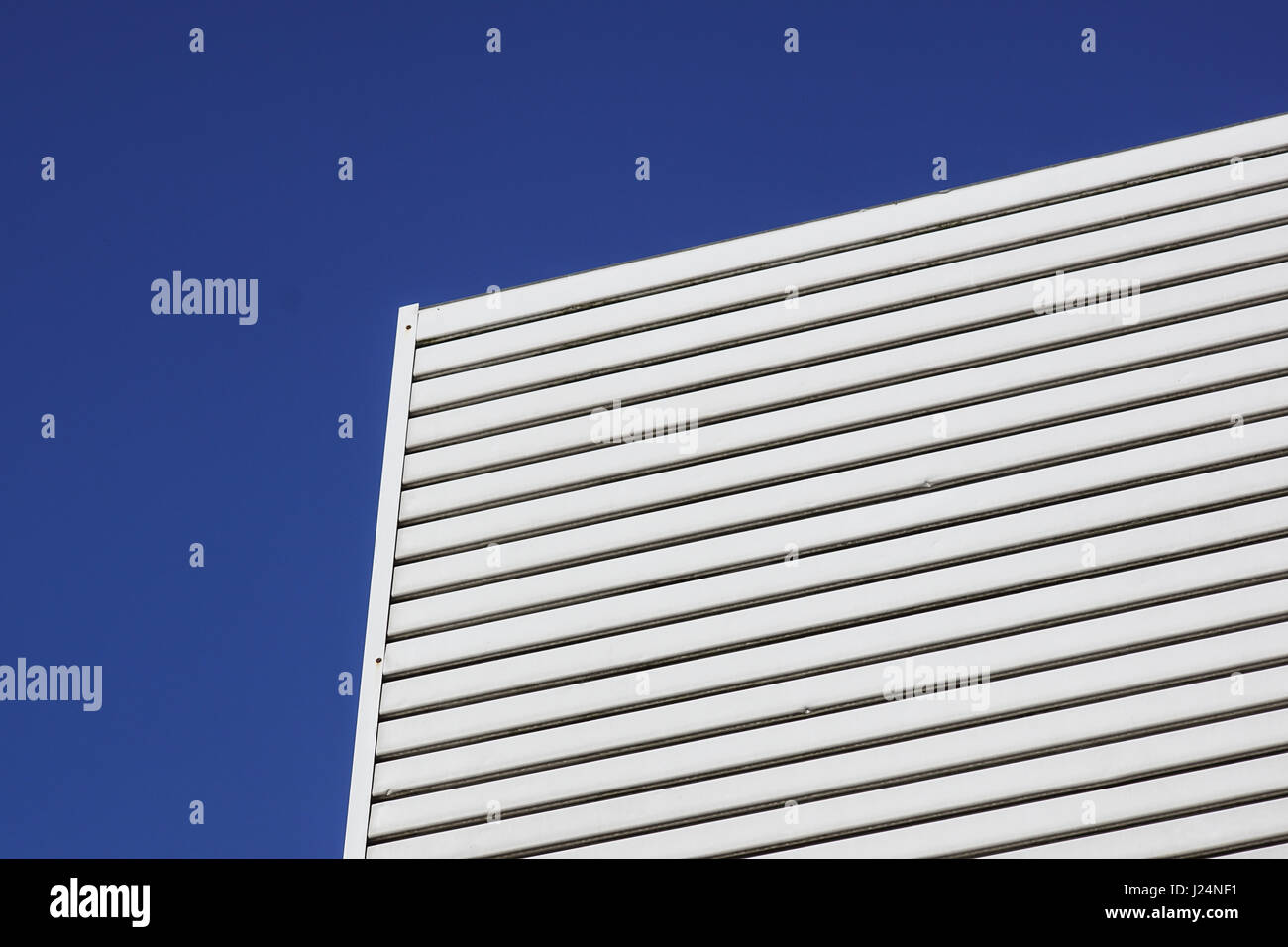 white aluminium architecture wall design pattern with light and shadow Stock Photo