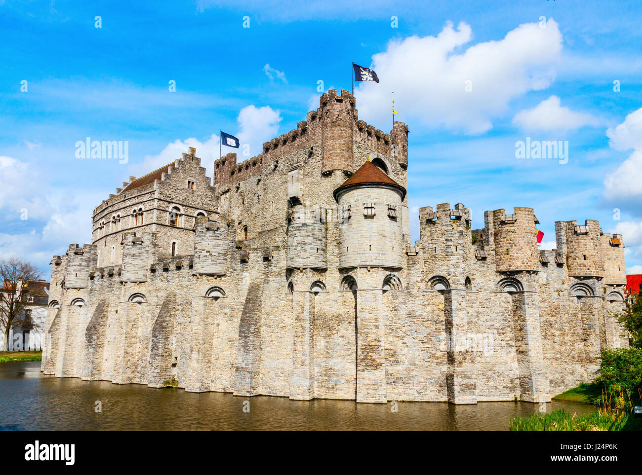 The medieval castle Gravesteen under a blue sky. Ghent, Belgium. Stock Photo