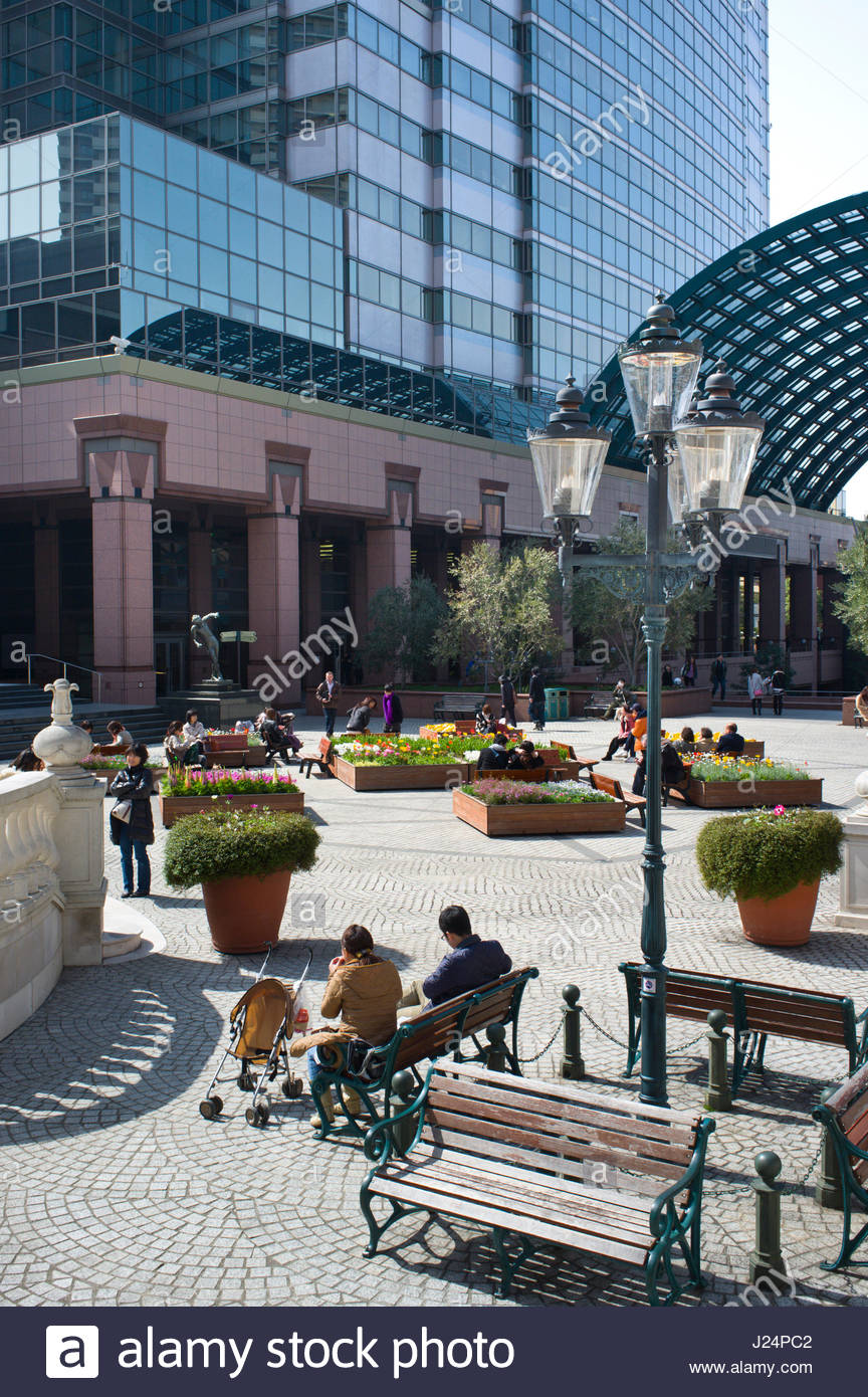 People Sitting On Benches Enjoying The Sunshine Yebisu Garden Place Stock Photo Alamy