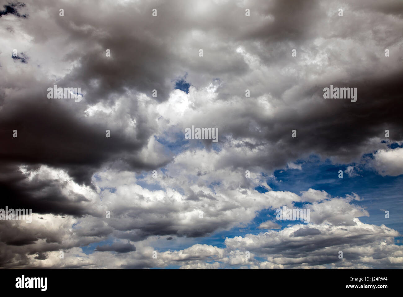 Clouds & sun against a Colorado blue background Stock Photo