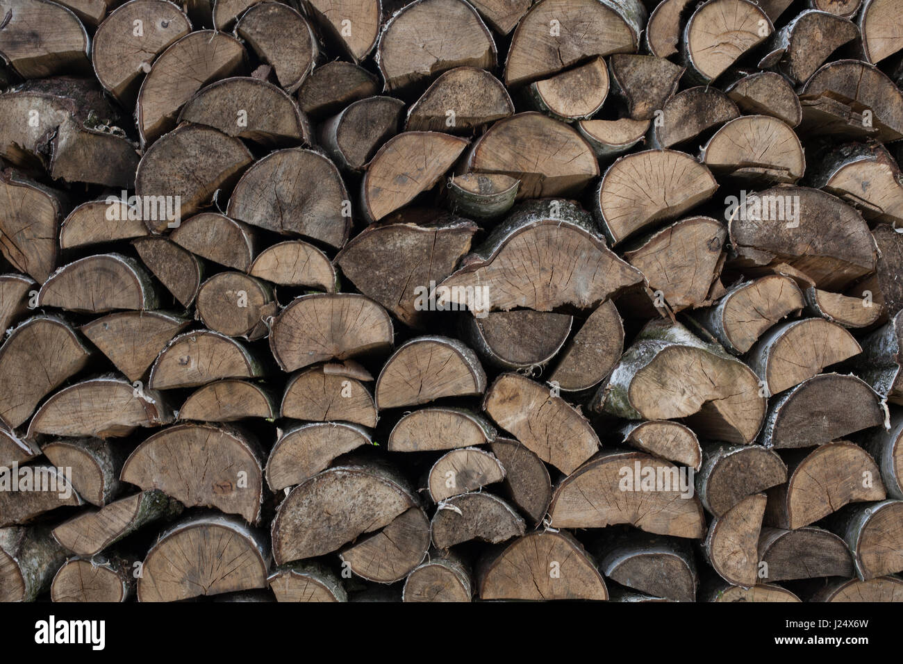 Stack, reserve of wood to the fireplace.  Natural fuel - wood Stock Photo