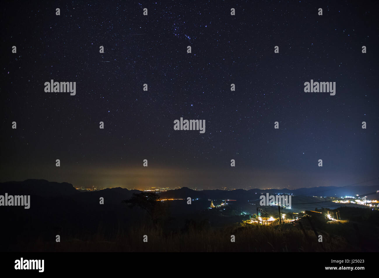 Geminid Meteor in the night sky over Wat Phra That Pha Son Kaew temple, Phetchabun Thailand Stock Photo