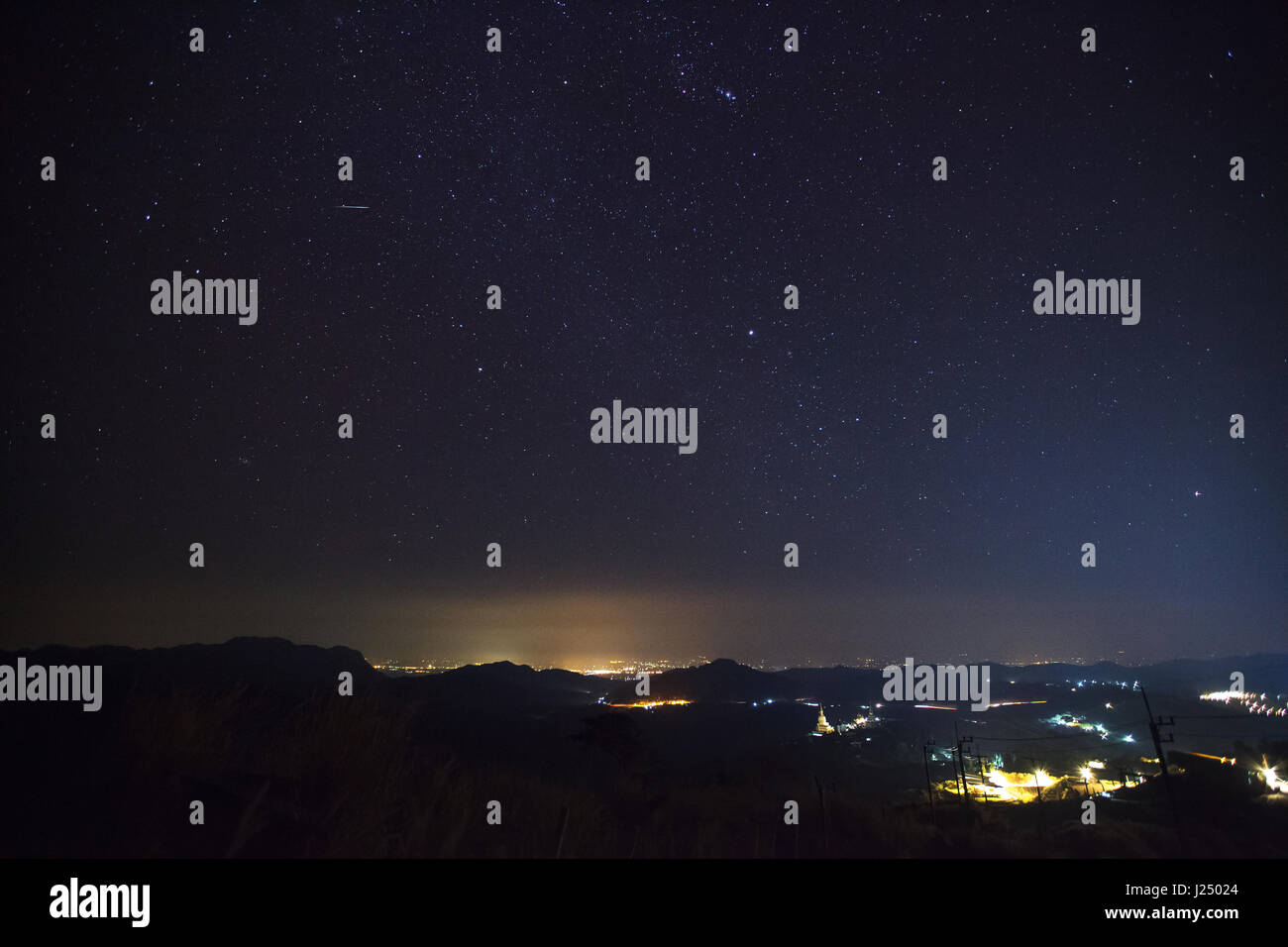 Geminid Meteor in the night sky over Wat Phra That Pha Son Kaew temple, Phetchabun Thailand Stock Photo