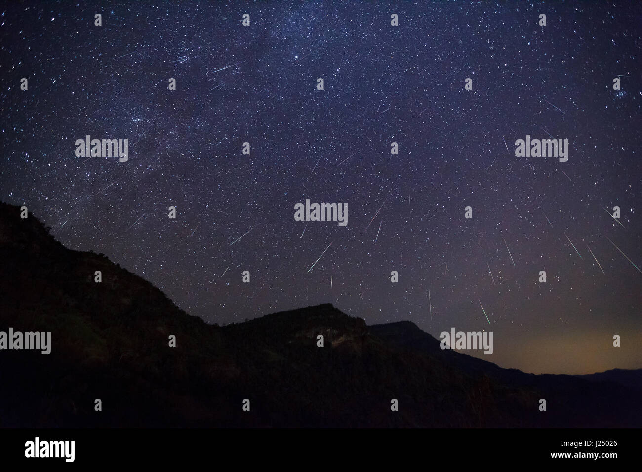 Geminid Meteor in the night sky Stock Photo