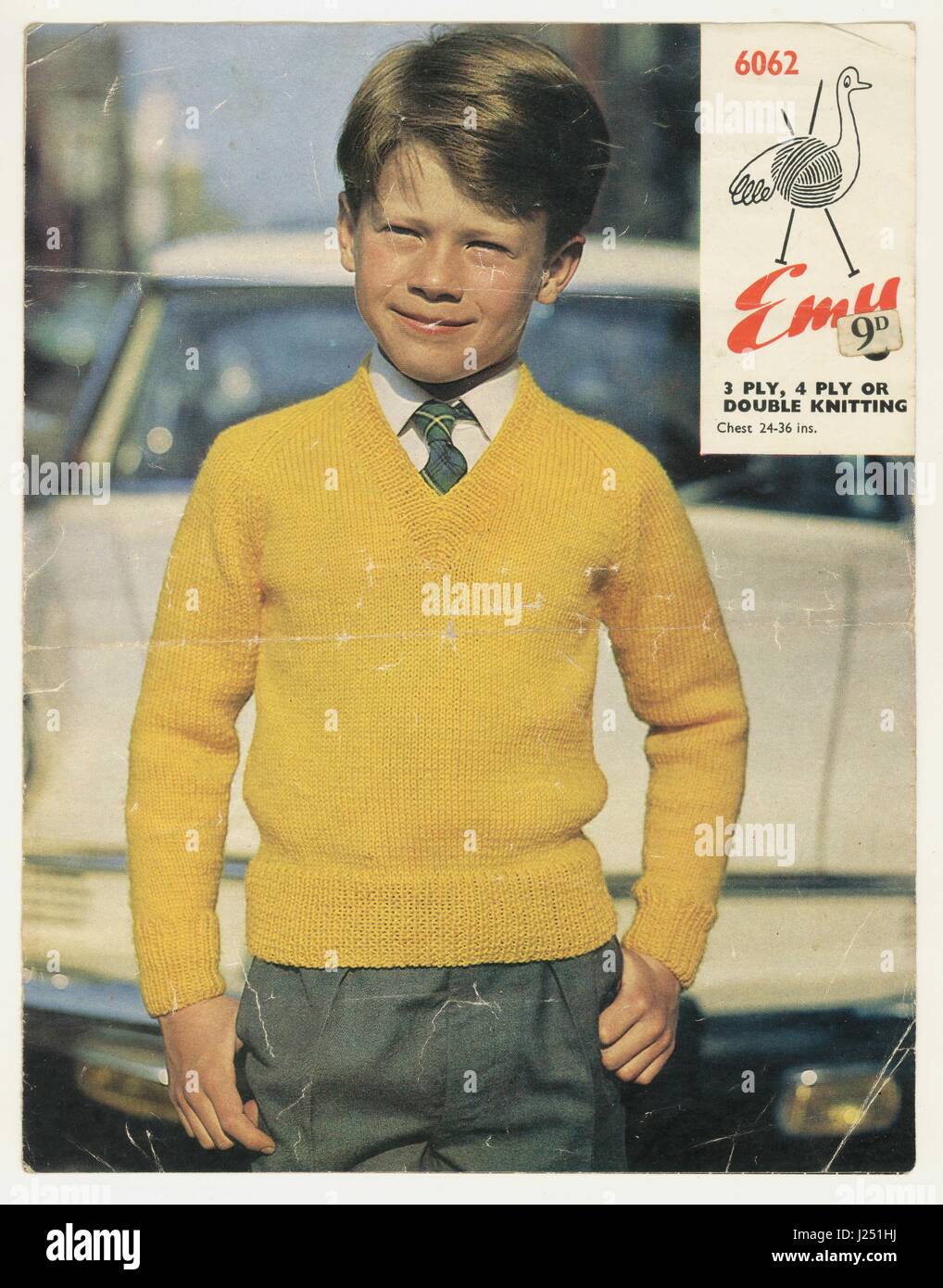 Original Emu knitting pattern for a boy's V necked jumper - the mustard yellow colour of the jumper was a popular colour in the 1960's, U.K. Stock Photo