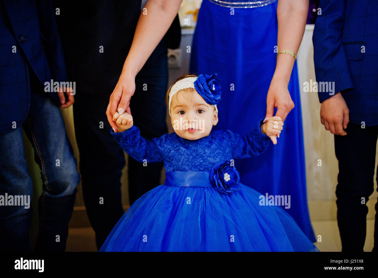 baby girl in blue dress