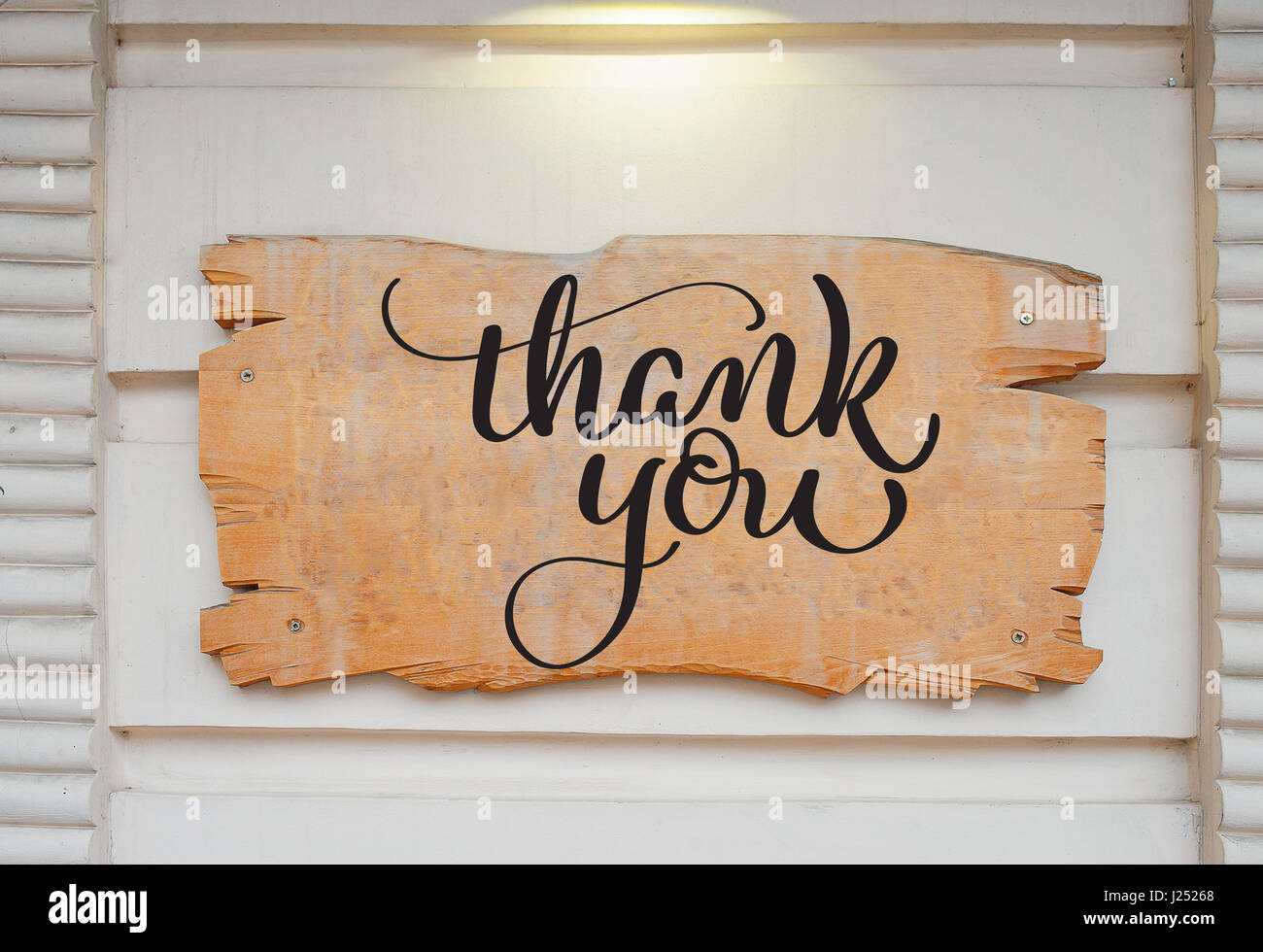 Blank wood board on wall and text Thank you. Calligraphy lettering hand  draw Stock Photo - Alamy