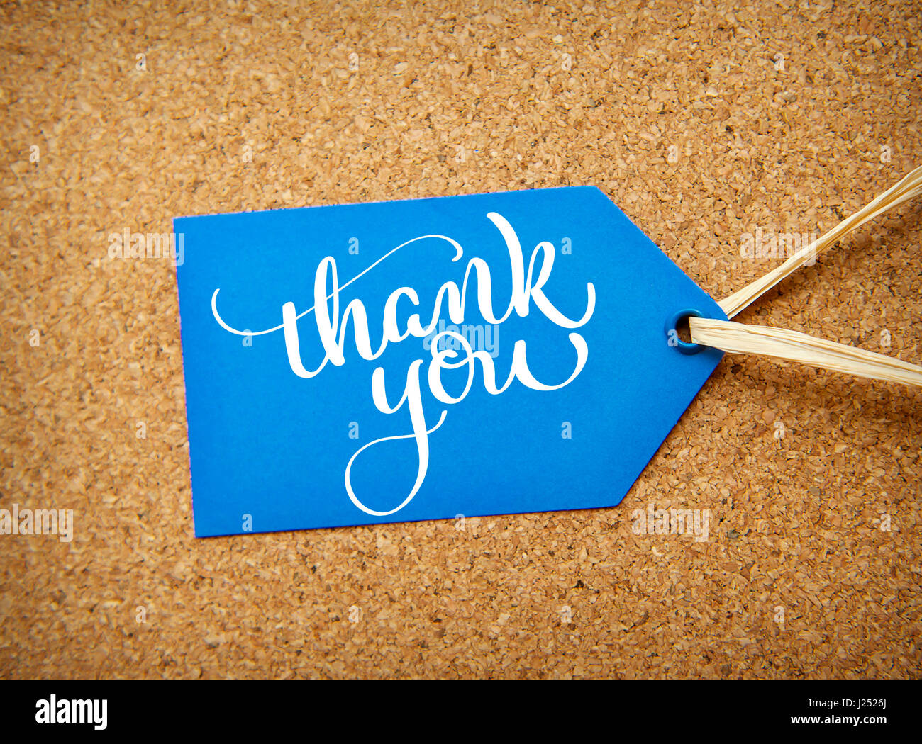 blue sticker sale on the cork background and text Thank you. Calligraphy lettering hand draw Stock Photo