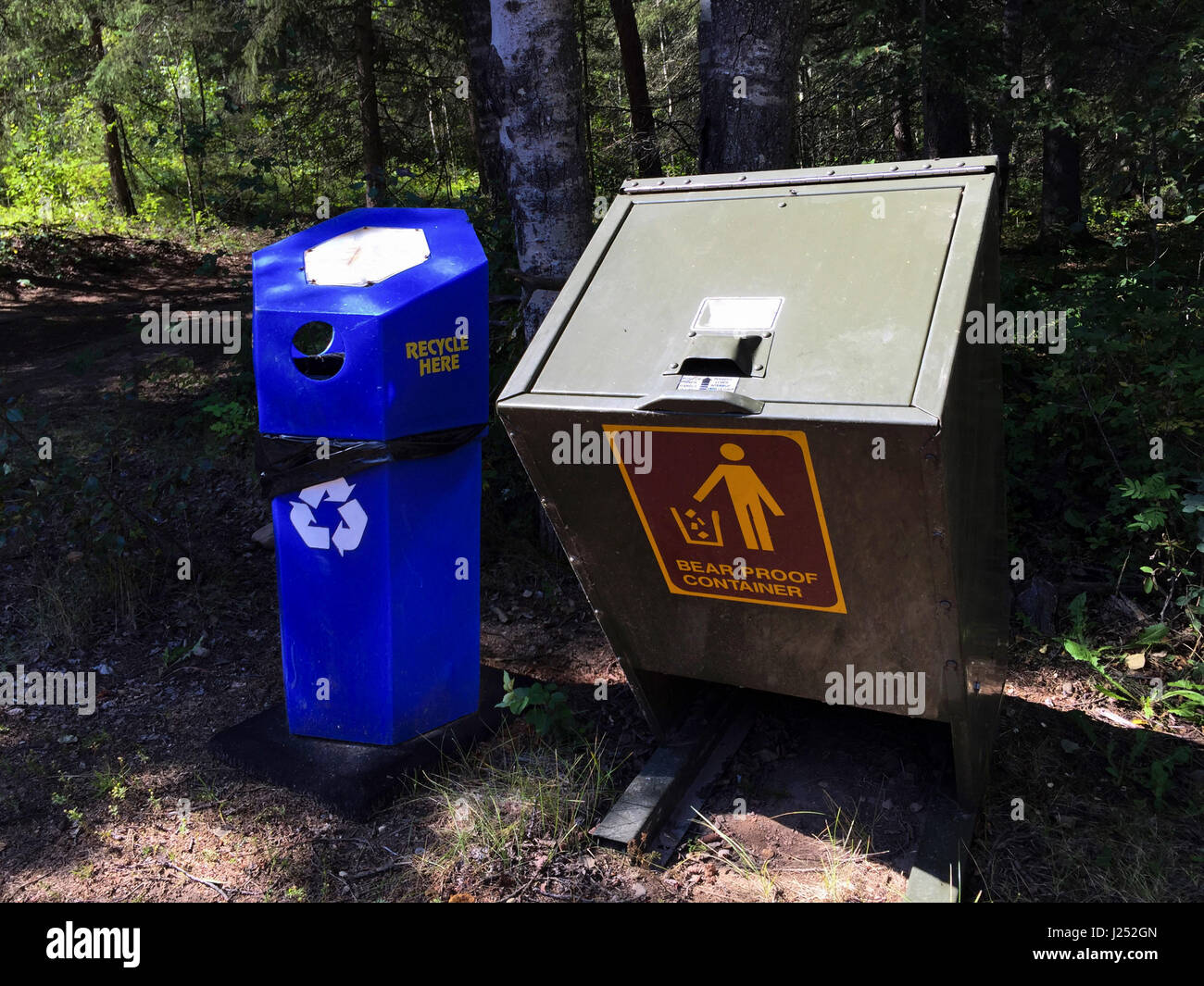 Bear Proof Container Next to Recycling Container. Stock Photo