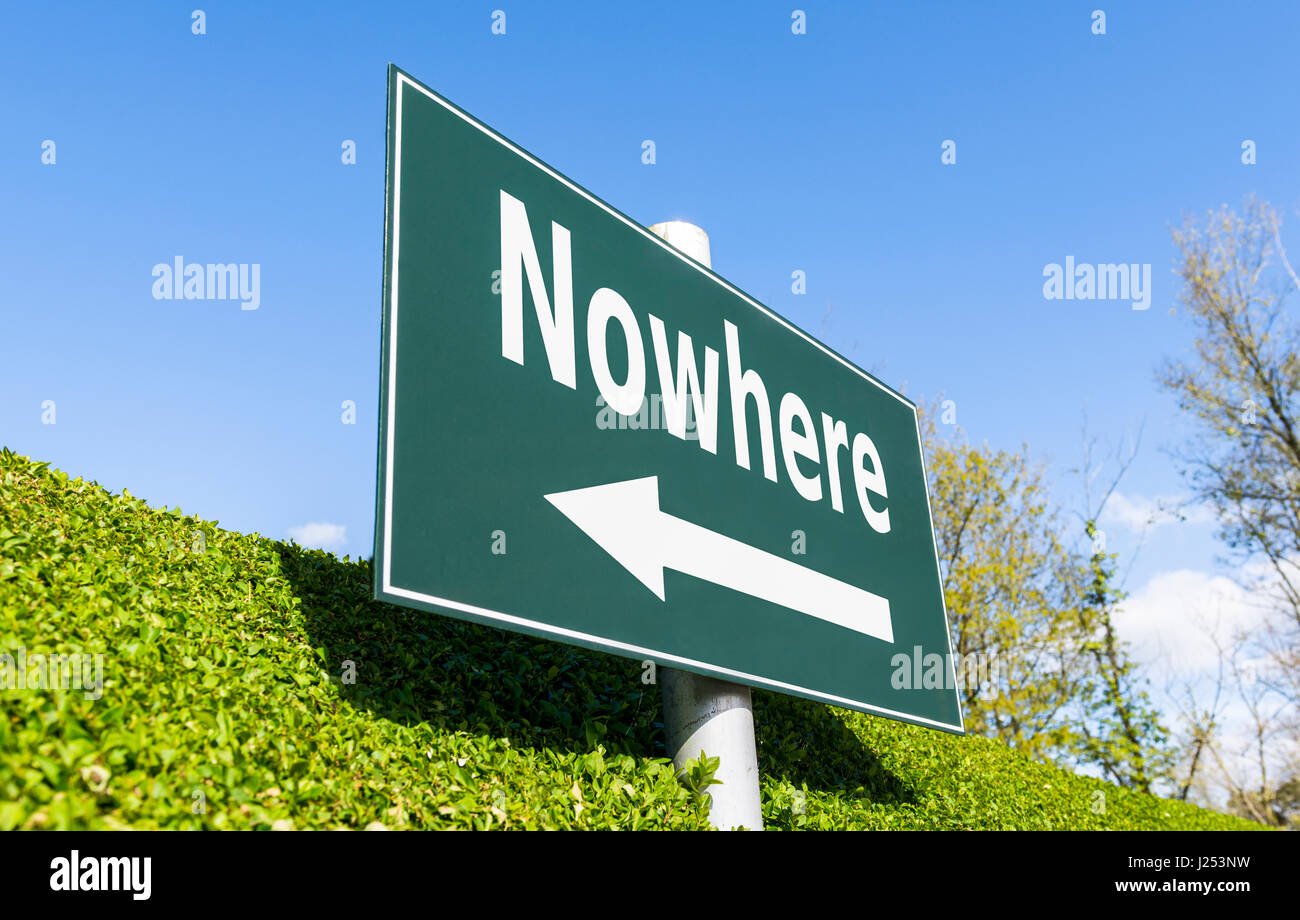 Nowhere concept. Signpost with 'nowhere' and a direction arrow. Stock Photo