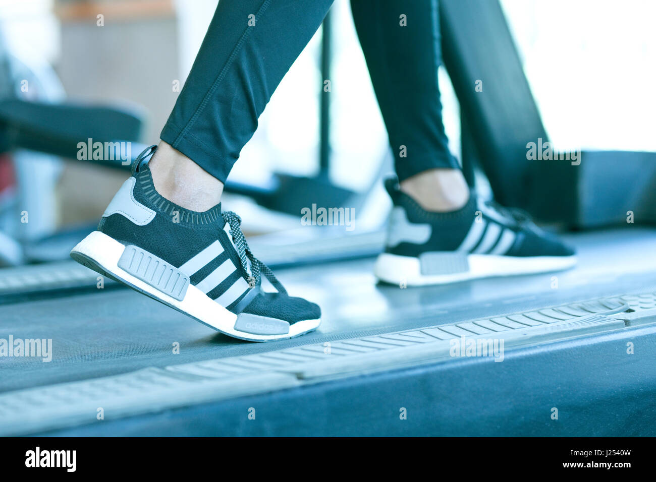 Man exercising on treadmill in a gym Stock Photo