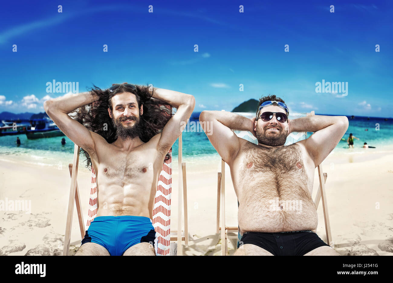 Two funny friends resting on the beach Stock Photo - Alamy