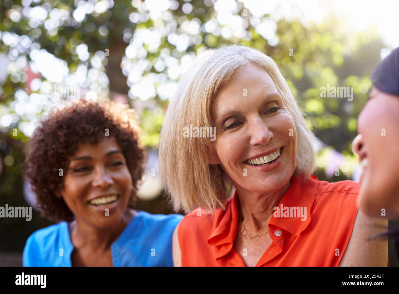 Mature women friends laughing home hi-res stock photography and images ...