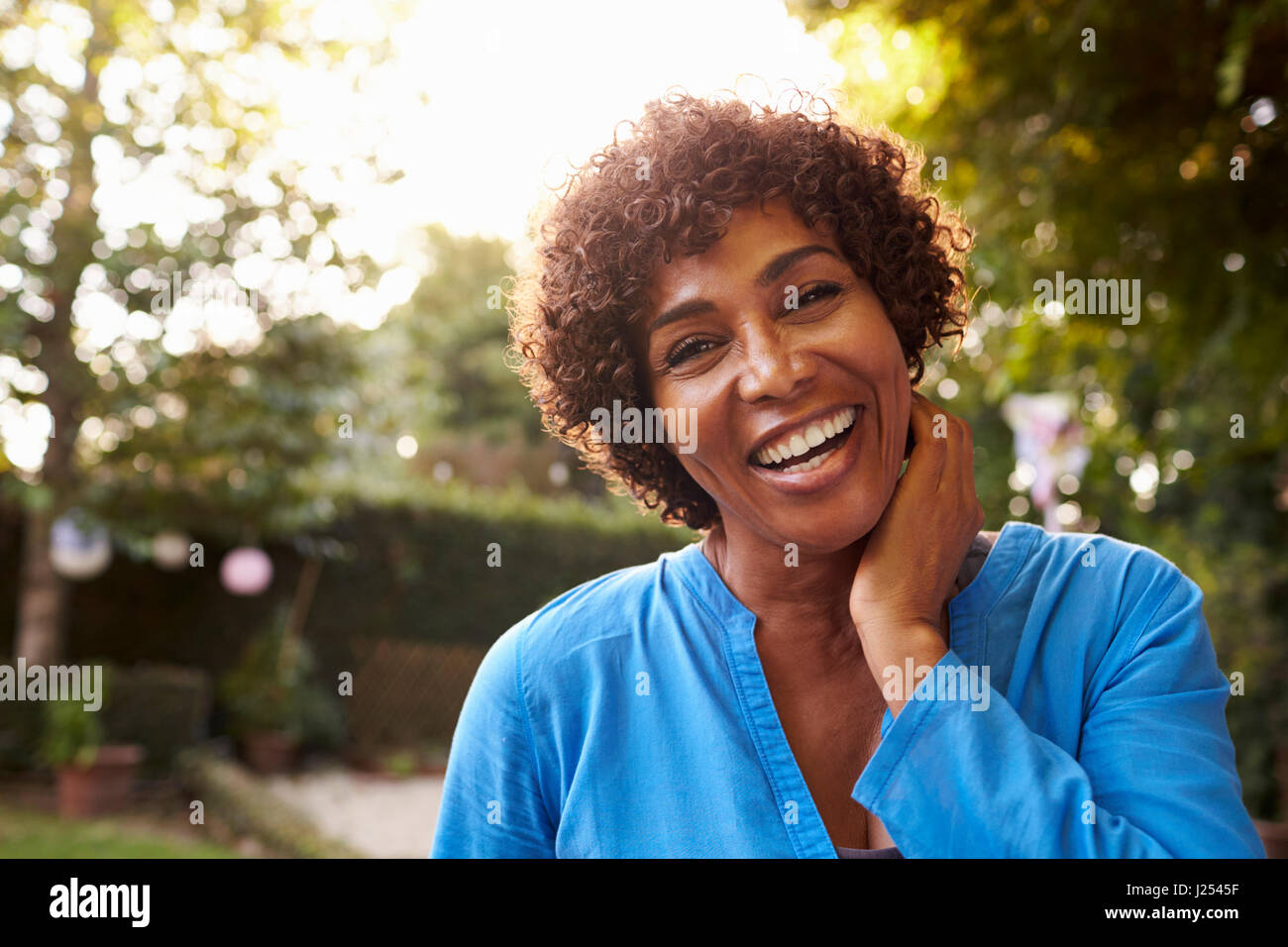 Portrait Of Mature Woman In Back Yard Garden Stock Photo - Alamy