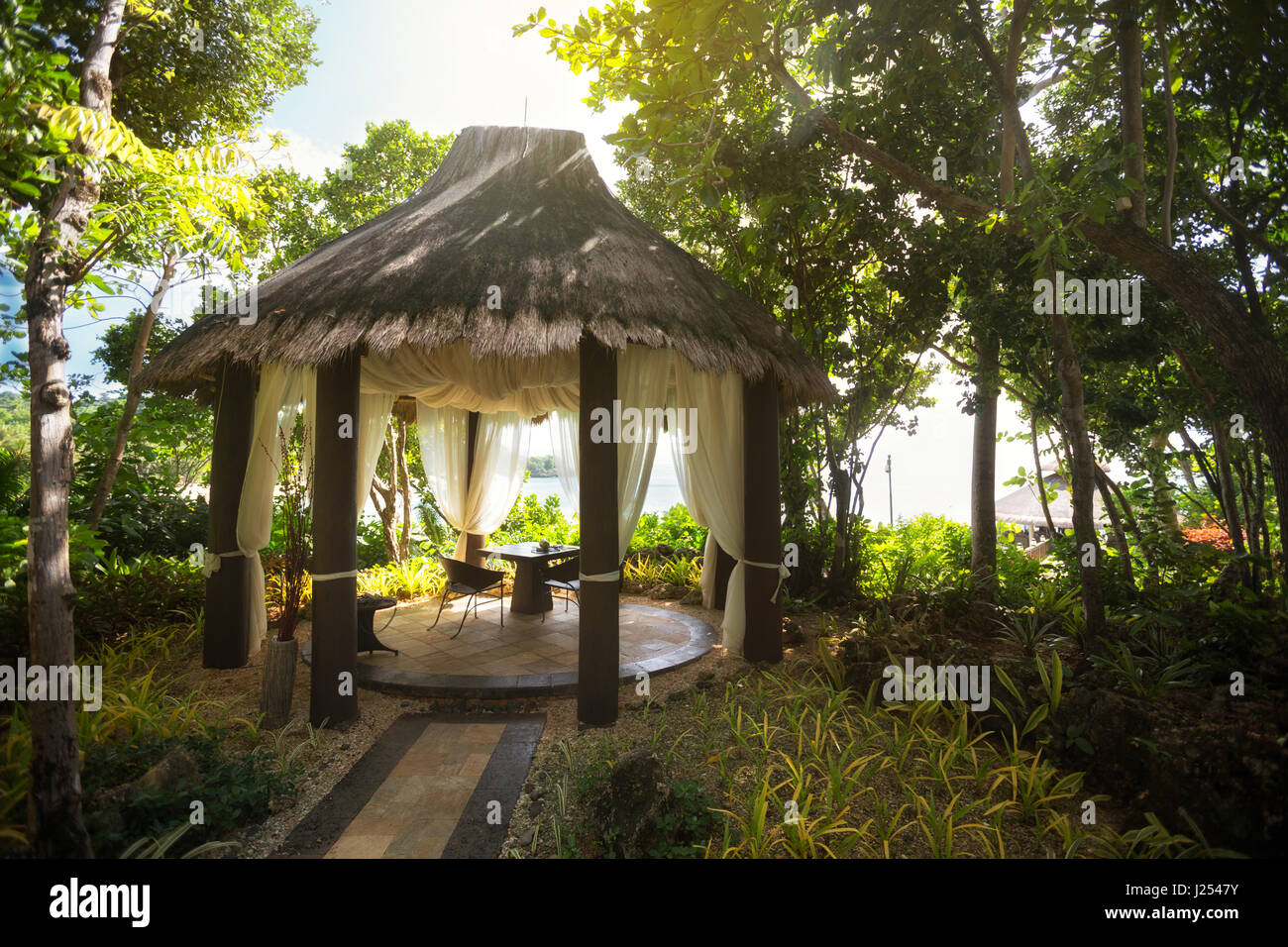 Private idyllic garden in tropical environment Stock Photo