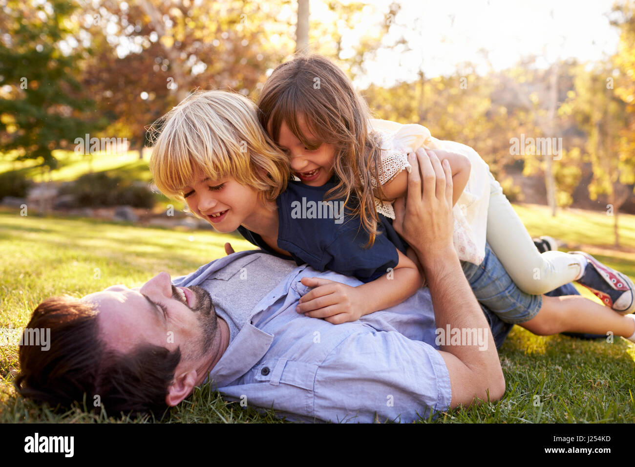 Smiling cute boy jumping hi-res stock photography and images - Alamy