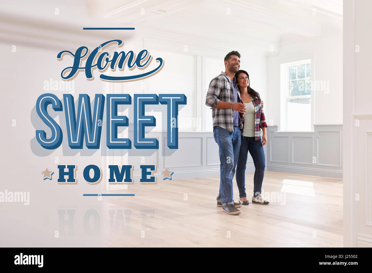 Hispanic Couple In Their New Home Sweet Home Stock Photo