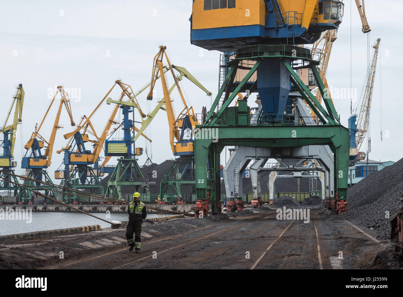 Work in port coal transshipment terminal Stock Photo - Alamy
