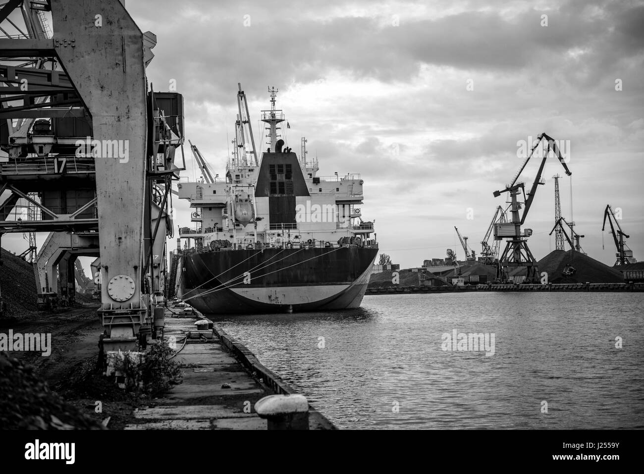 Ships and cranes at a port terminal. Stock Photo