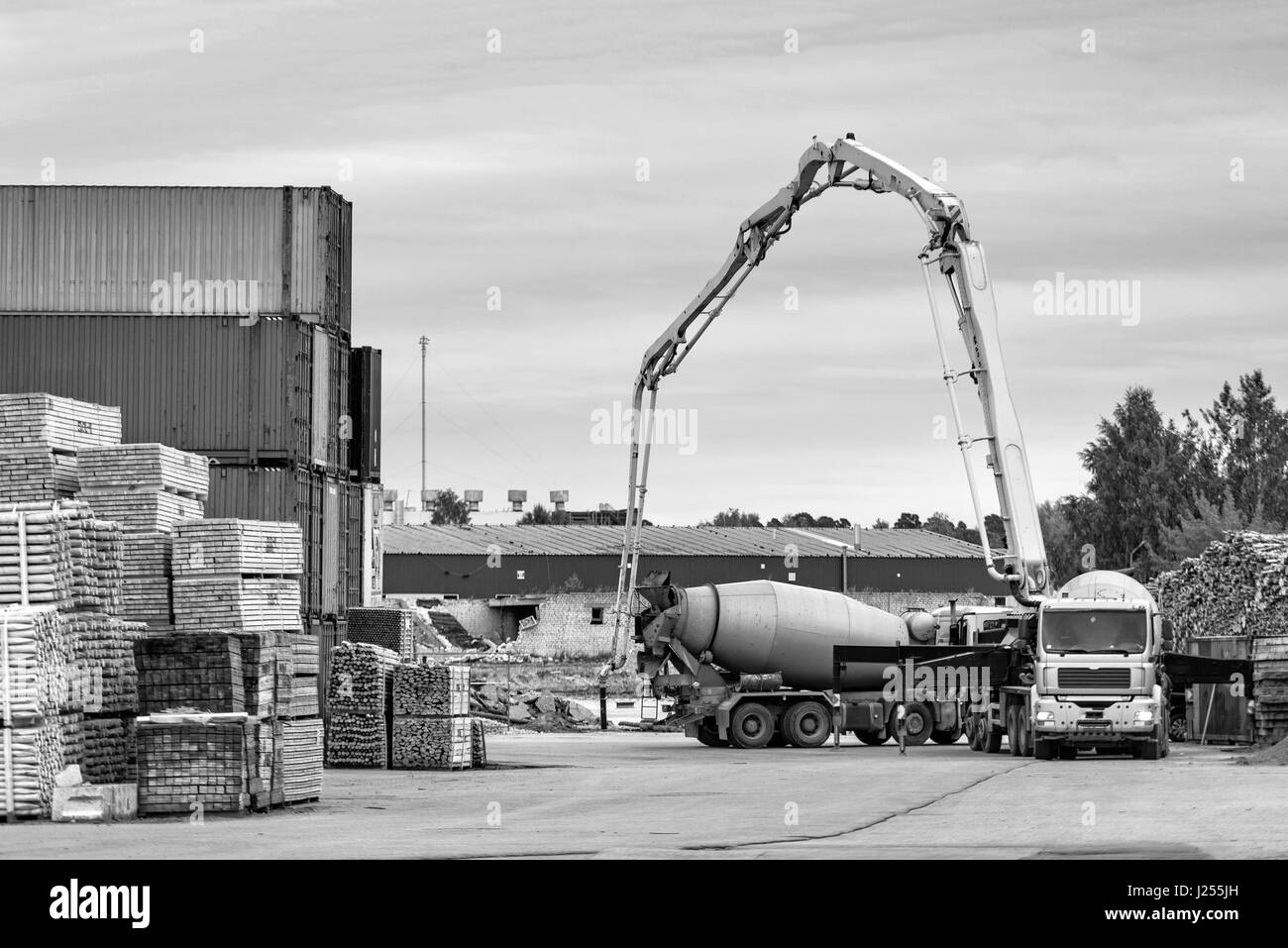 Concrete equipment works out of the port warehouse area. Stock Photo