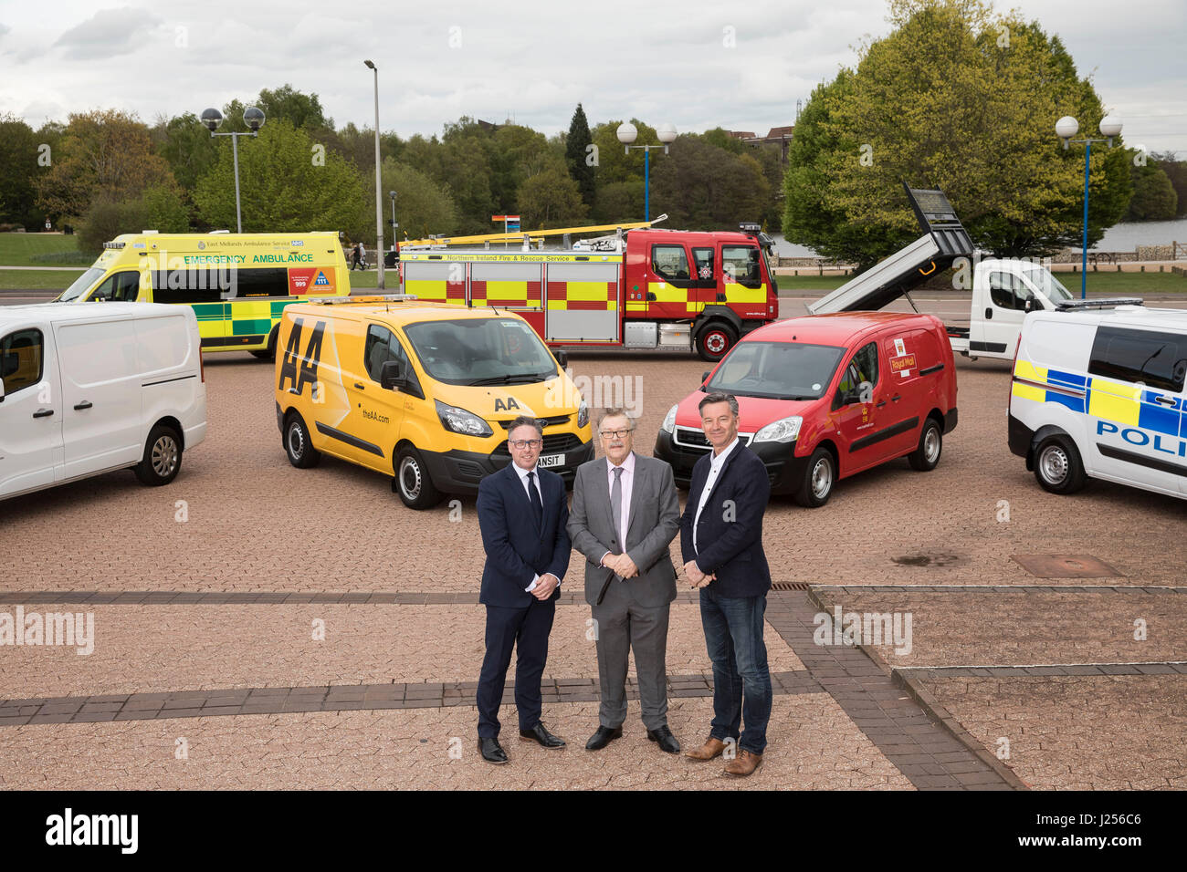 (Left to right) Richard Burnett (Road Haulage Association Chief Executive), Ian Chisholm (SOE, Society of Operations Engineers) and Mike Hawes (CEO of Society of Motor Manufacturers and Traders) pose in front of seven Euro VI emergency response, service and delivery vehicles on display at the 2017 Commercial Vehicle Show at the Birmingham NEC. Front row (left to right): Vauxhall Vivaro, AA Ford Transit, Peugeot Royal Mail Partner Van and Ford Transit Police Van. Back row (left to right): Fiat Ducato Ambulance, Volvo Fire Tender FL Truck and Citroen 'Relay Ready to Run' Tipper. Stock Photo