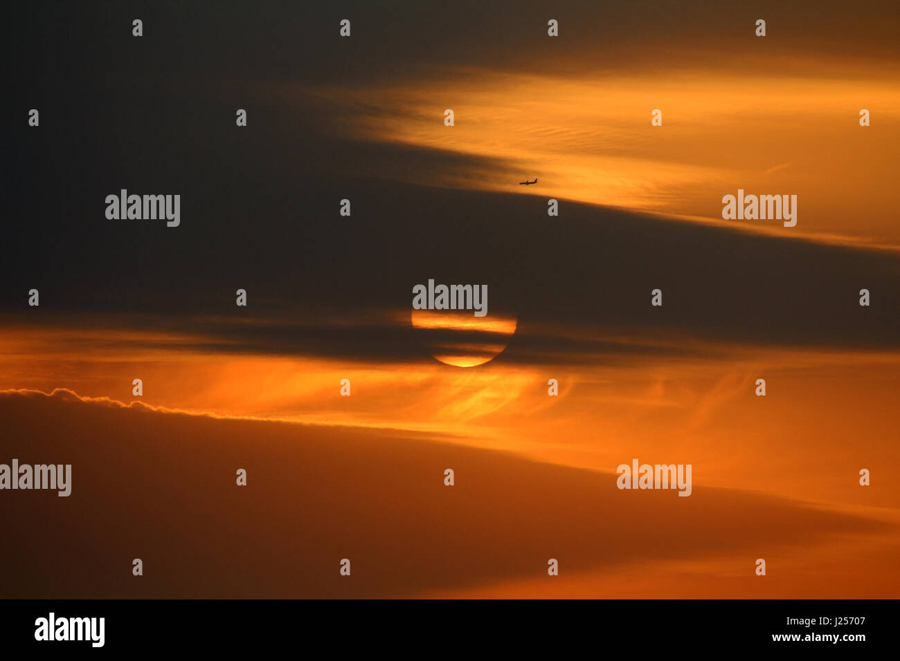 Sunset or sunrise with clouds, light and other atmospheric effects