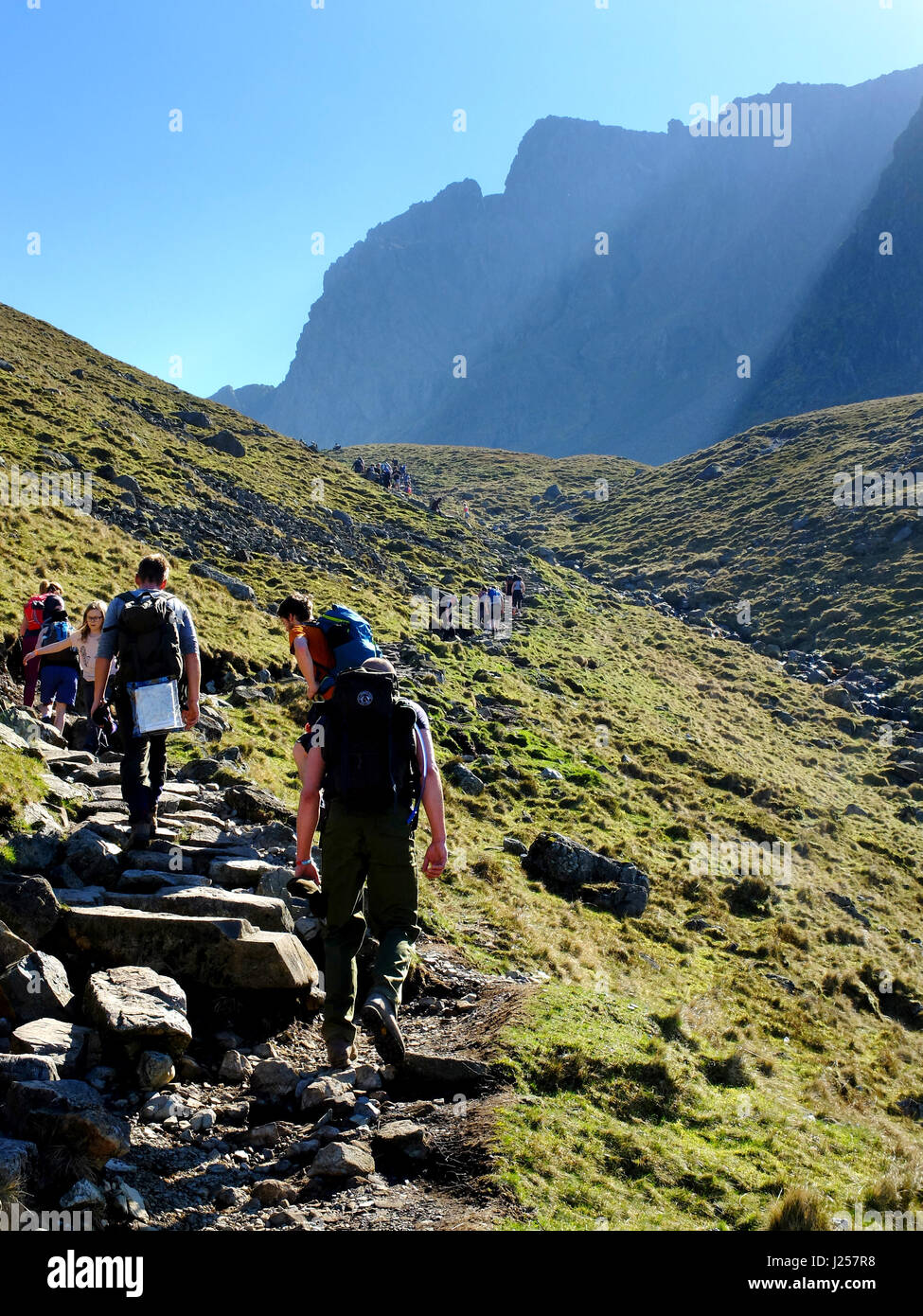 People hiking up to Scafell Pike in the Lade District, Cumbria, England's highest mountain. Stock Photo