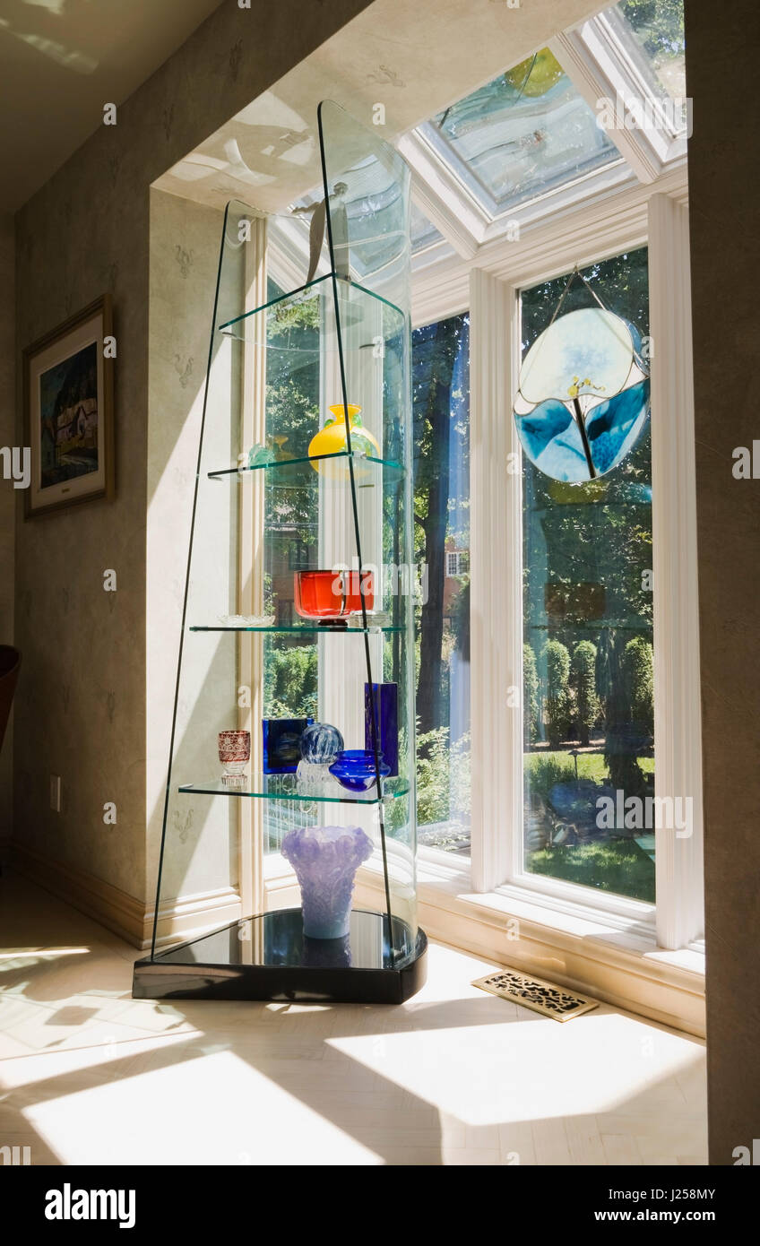 Glass shelf display unit in a dining room inside a residential home