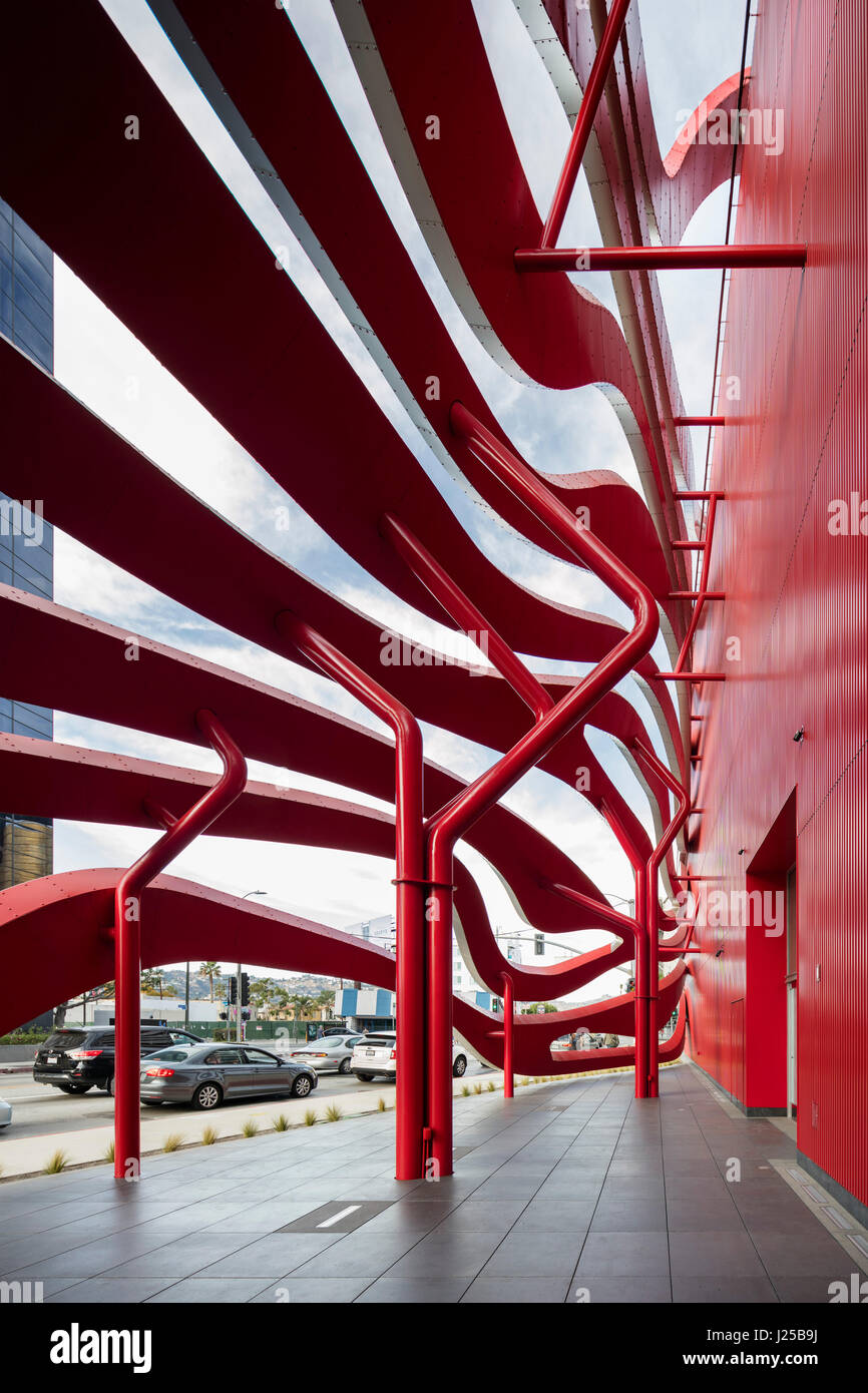Public space enclosed by red steel ribbons. Petersen Automotive Museum