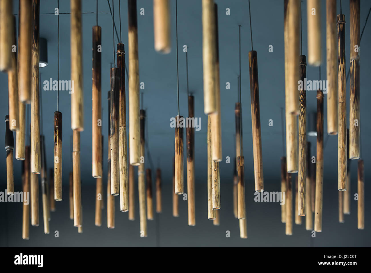 Hanging wooden tubes Stock Photo