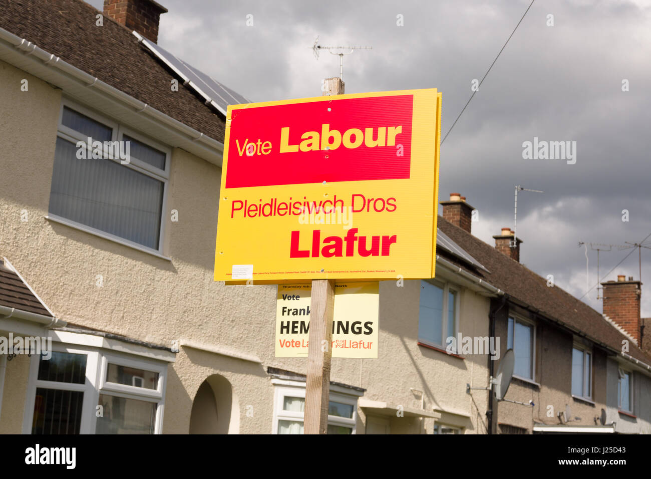 Vote Welsh Labour sign in a council estate in Wrexham North Wales with dark stormy skies hanging overhead. Stock Photo