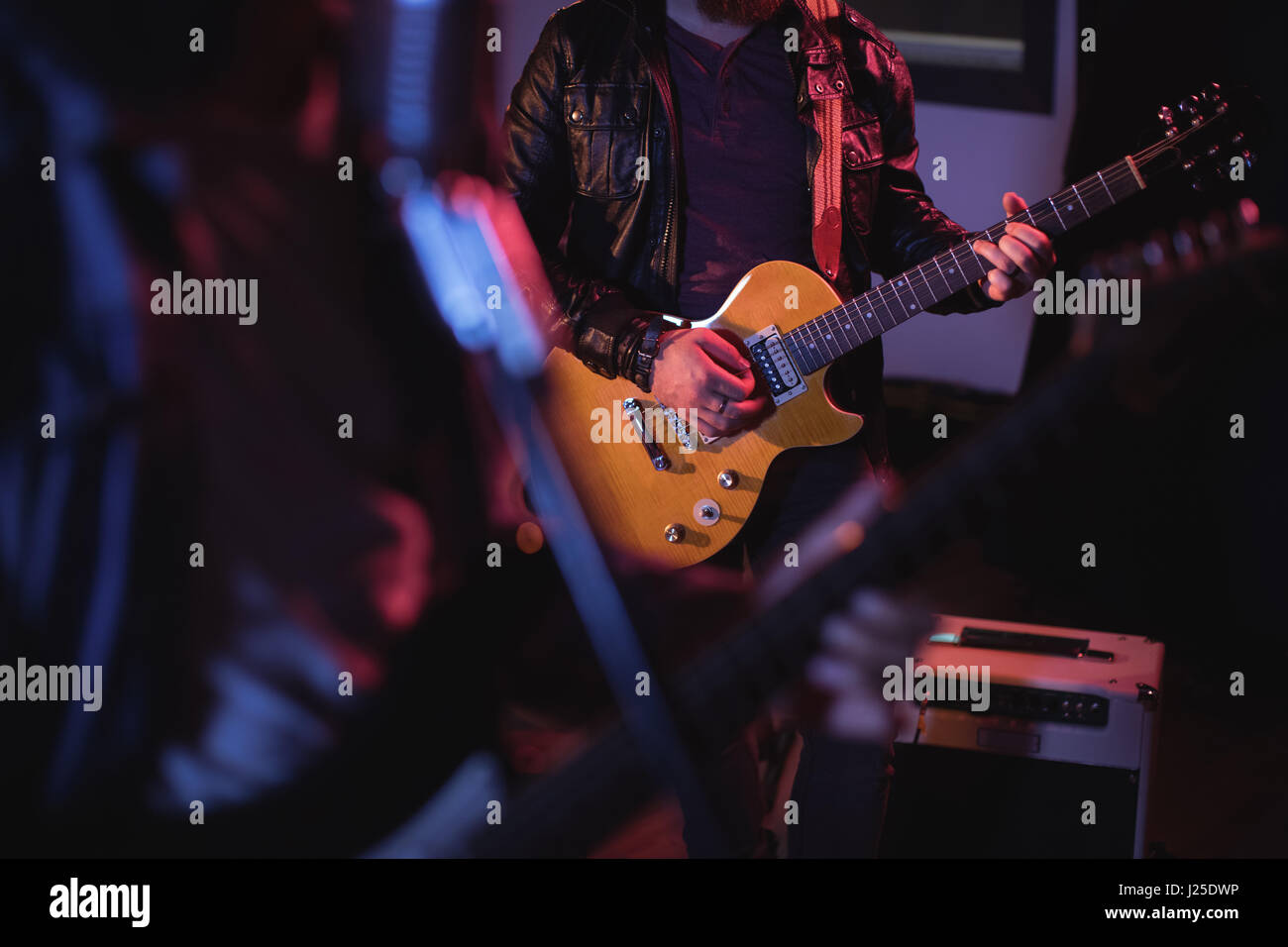 Musician playing electronic guitar in recording studio Stock Photo Alamy