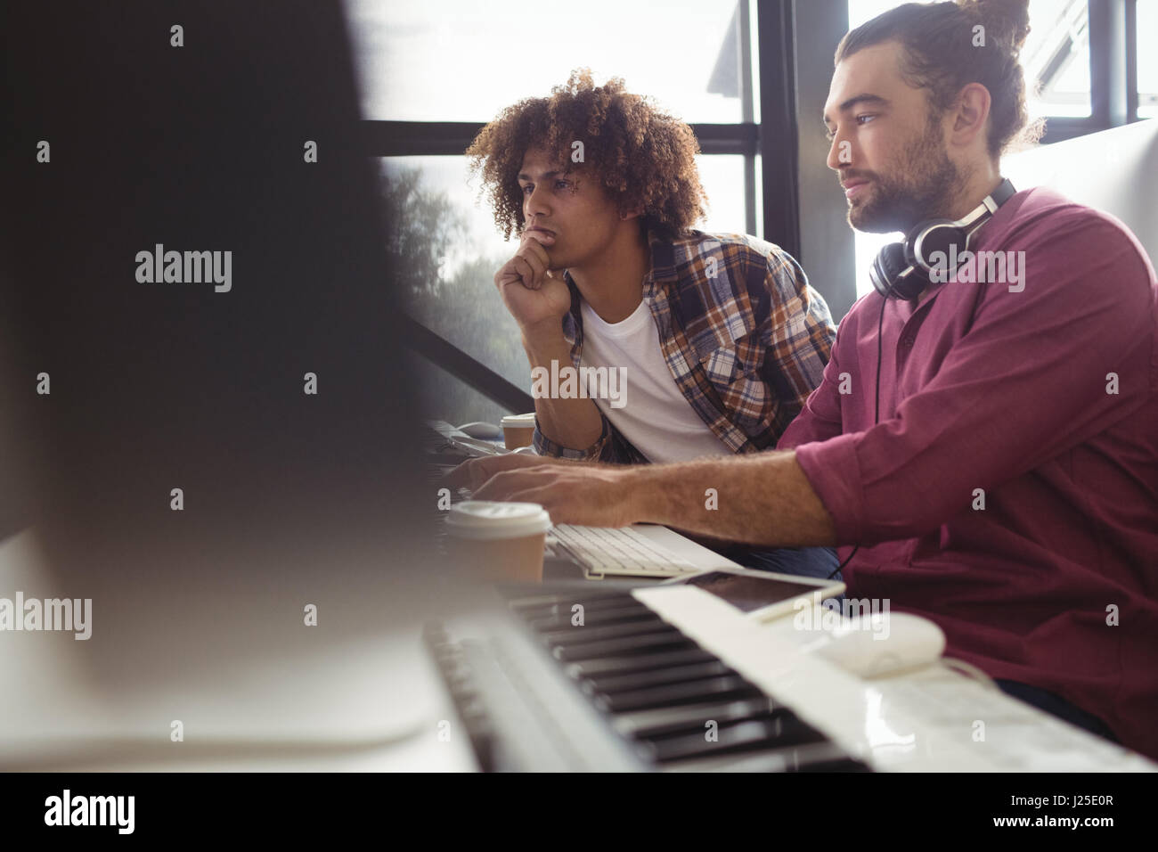 Two sound engineers working together in studio Stock Photo - Alamy
