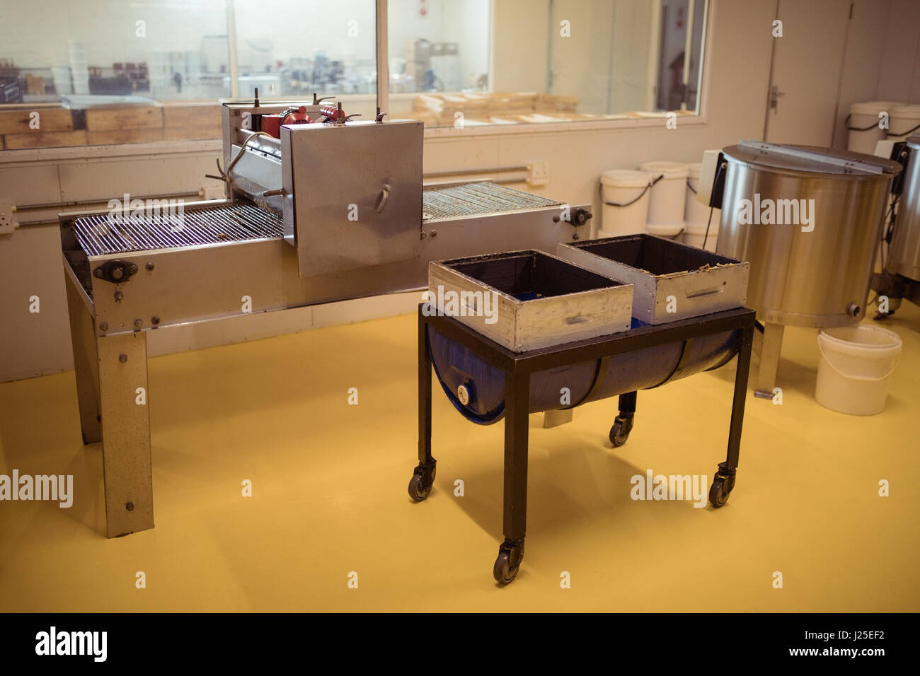 Honey extraction machinery in factory Stock Photo Alamy