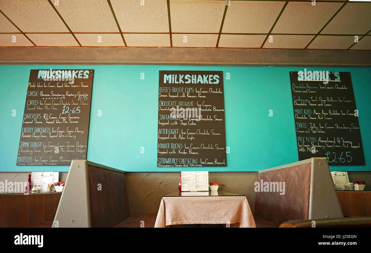 Chalk menu boards on cafe wall Stock Photo